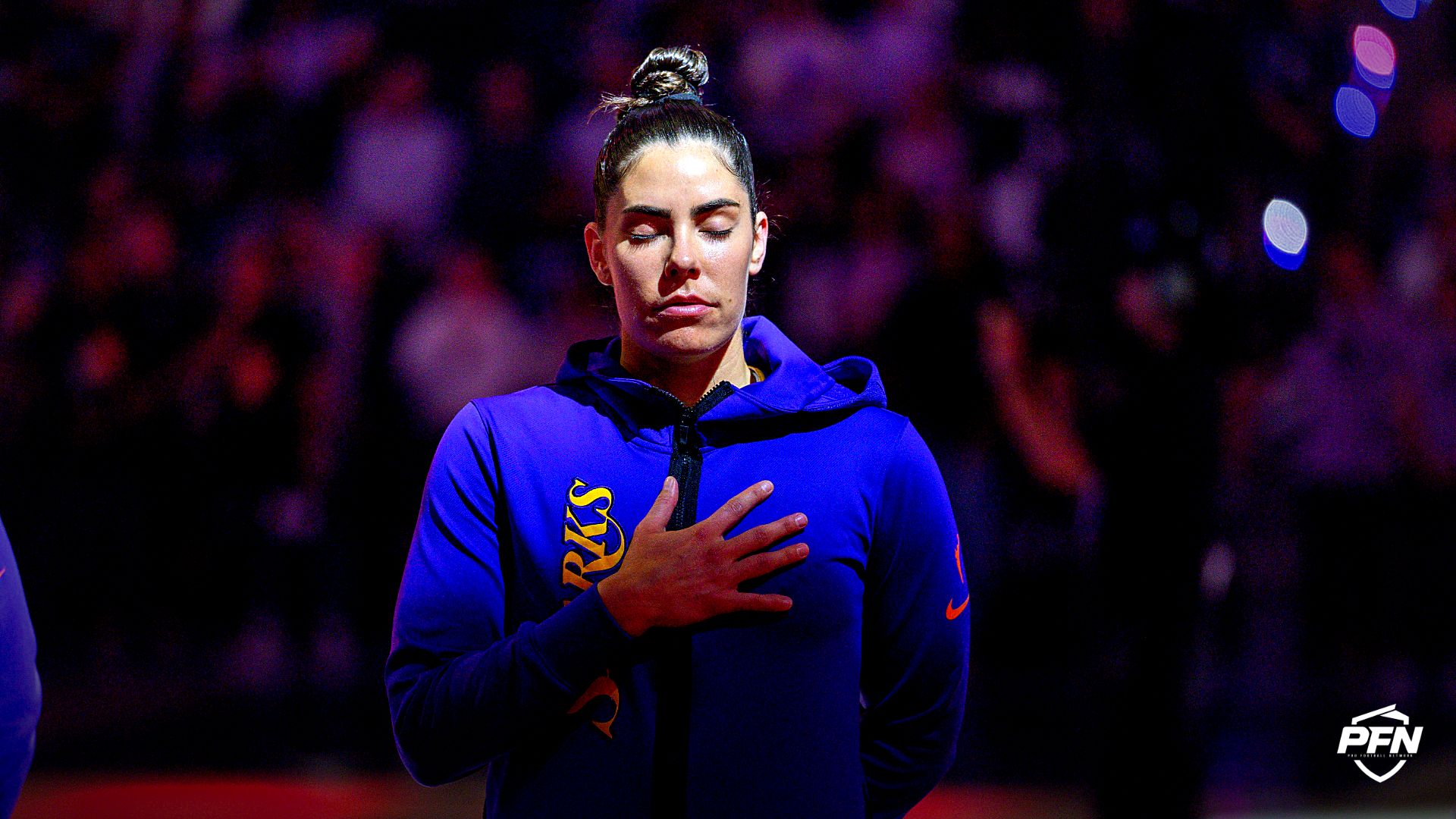 Angeles Sparks guard Kelsey Plum (10) listens to the National Anthem before the game against the Golden State Valkyries in a Commissionerâs Cup game at Chase Center.