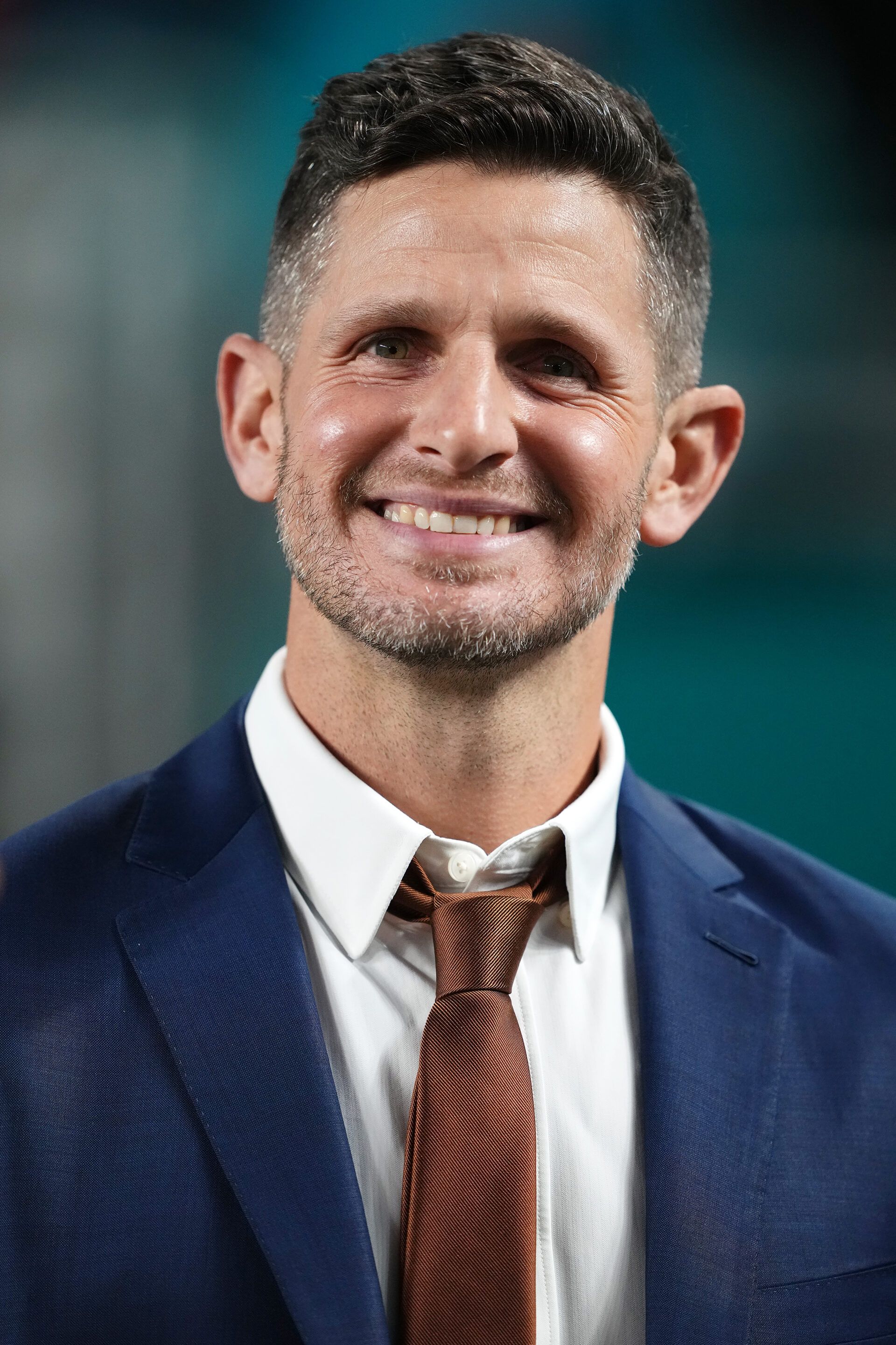 ESPN football analyst Dan Orlovsky stands on the sideline prior to the game between the Miami Dolphins and the Tennessee Titans at Hard Rock Stadium.