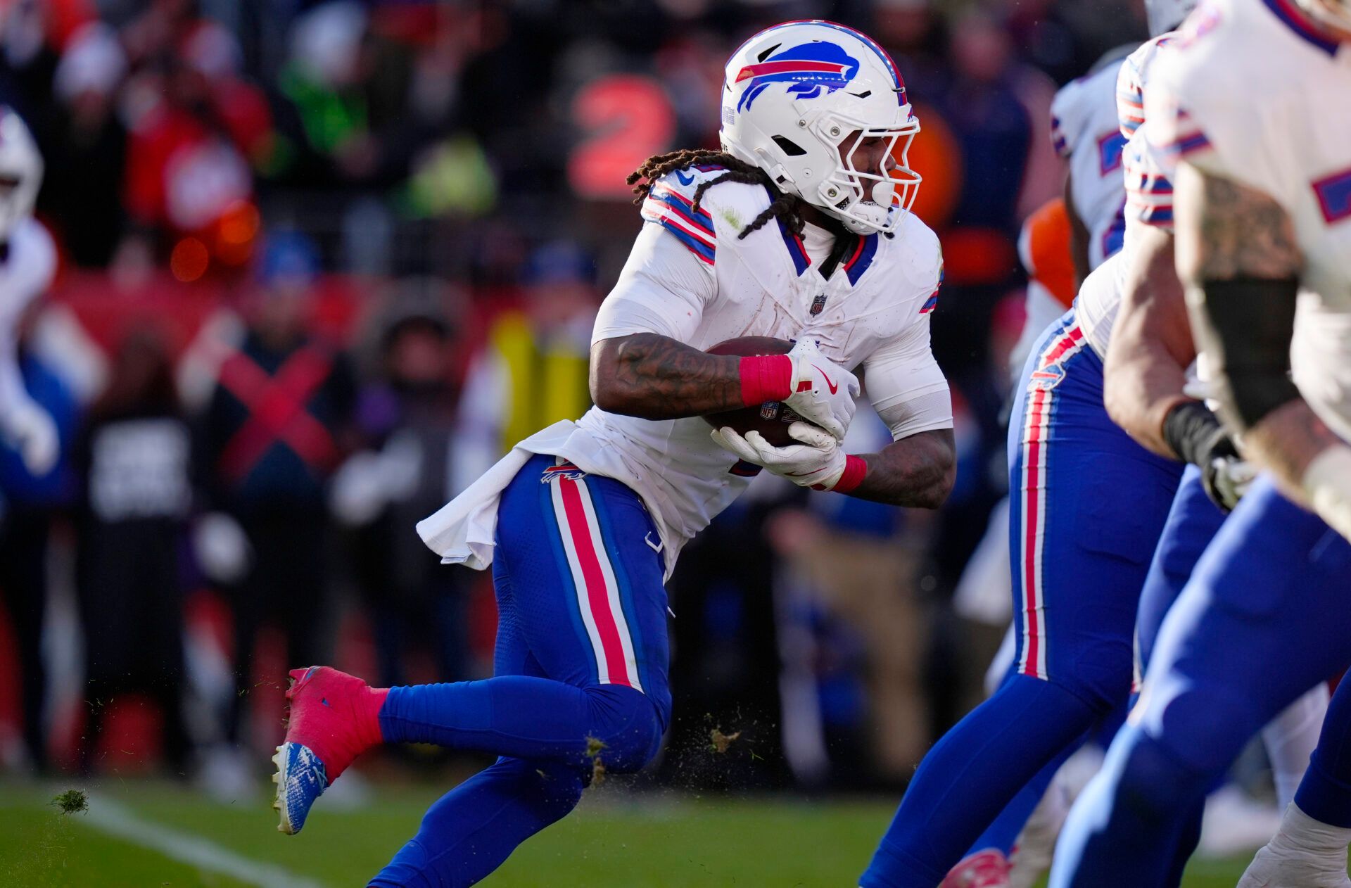 Buffalo Bills running back James Cook III (4) runs during the second quarter of an AFC Divisional Round playoff game against the Denver Broncos at Empower Field at Mile High.