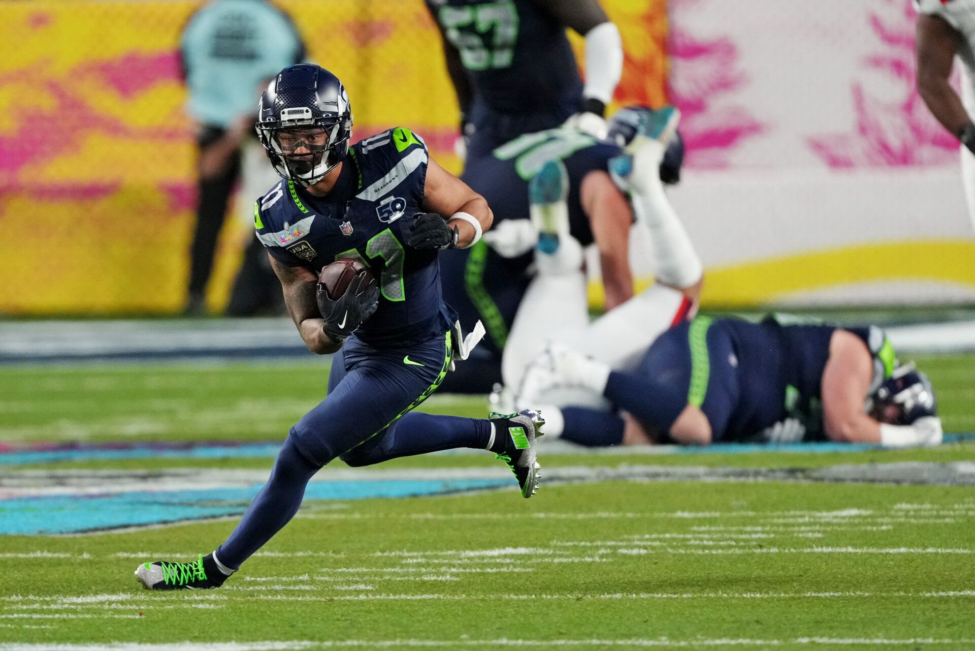 Seattle Seahawks wide receiver Jaxon Smith-Njigba (11) runs the ball during the third quarter against the New England Patriots in Super Bowl LX at Levi's Stadium.