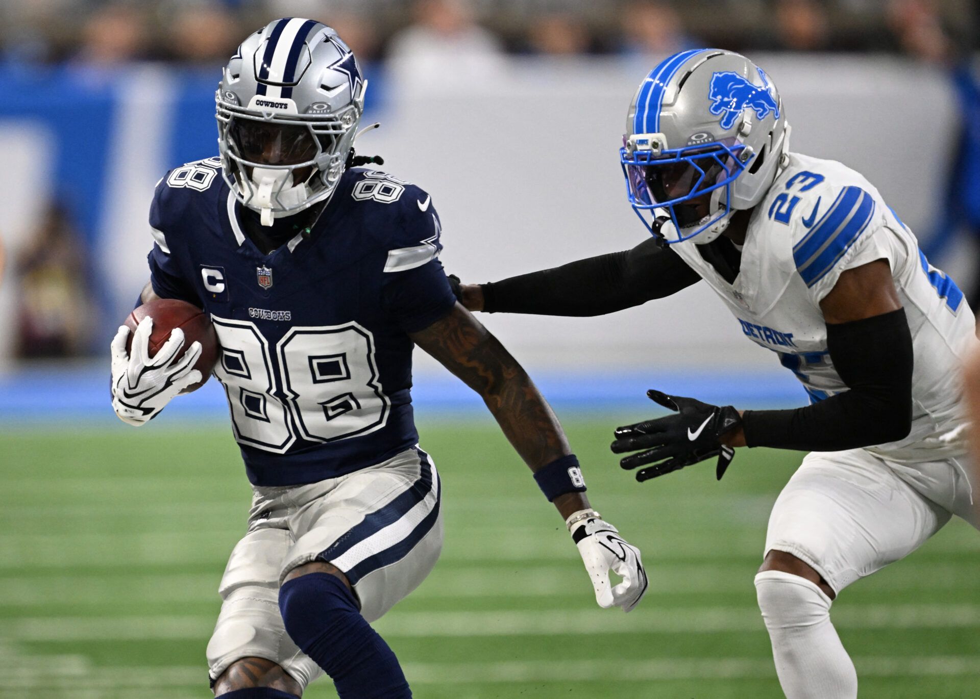 Dallas Cowboys wide receiver CeeDee Lamb (88) runs against Detroit Lions cornerback Rock Ya-Sin (23) during the first half at Ford Field.