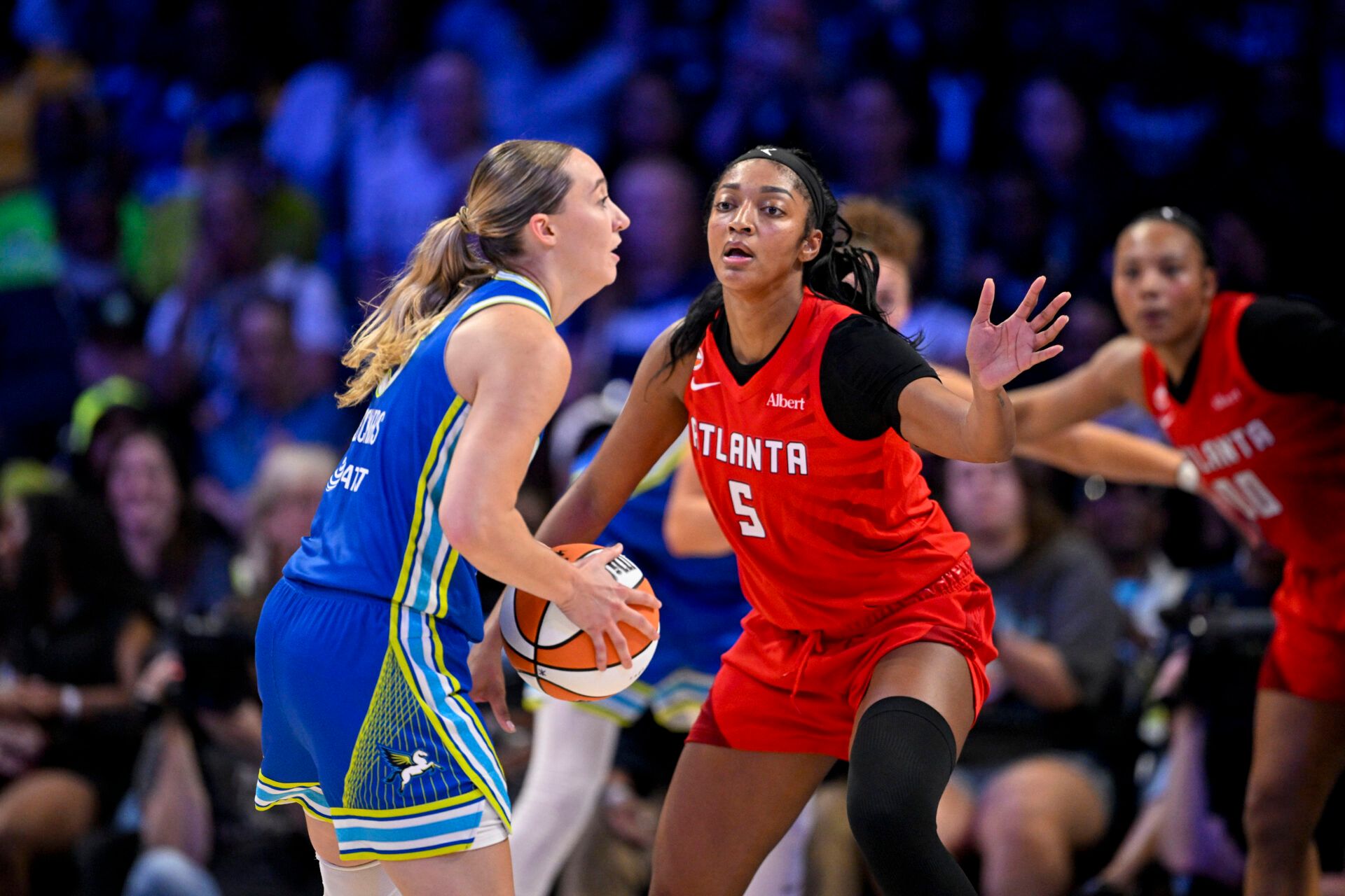 Dallas Wings guard Paige Bueckers (5) and Atlanta Dream forward Angel Reese (5) during the game between the Wings and the Dream at College Park Center.
