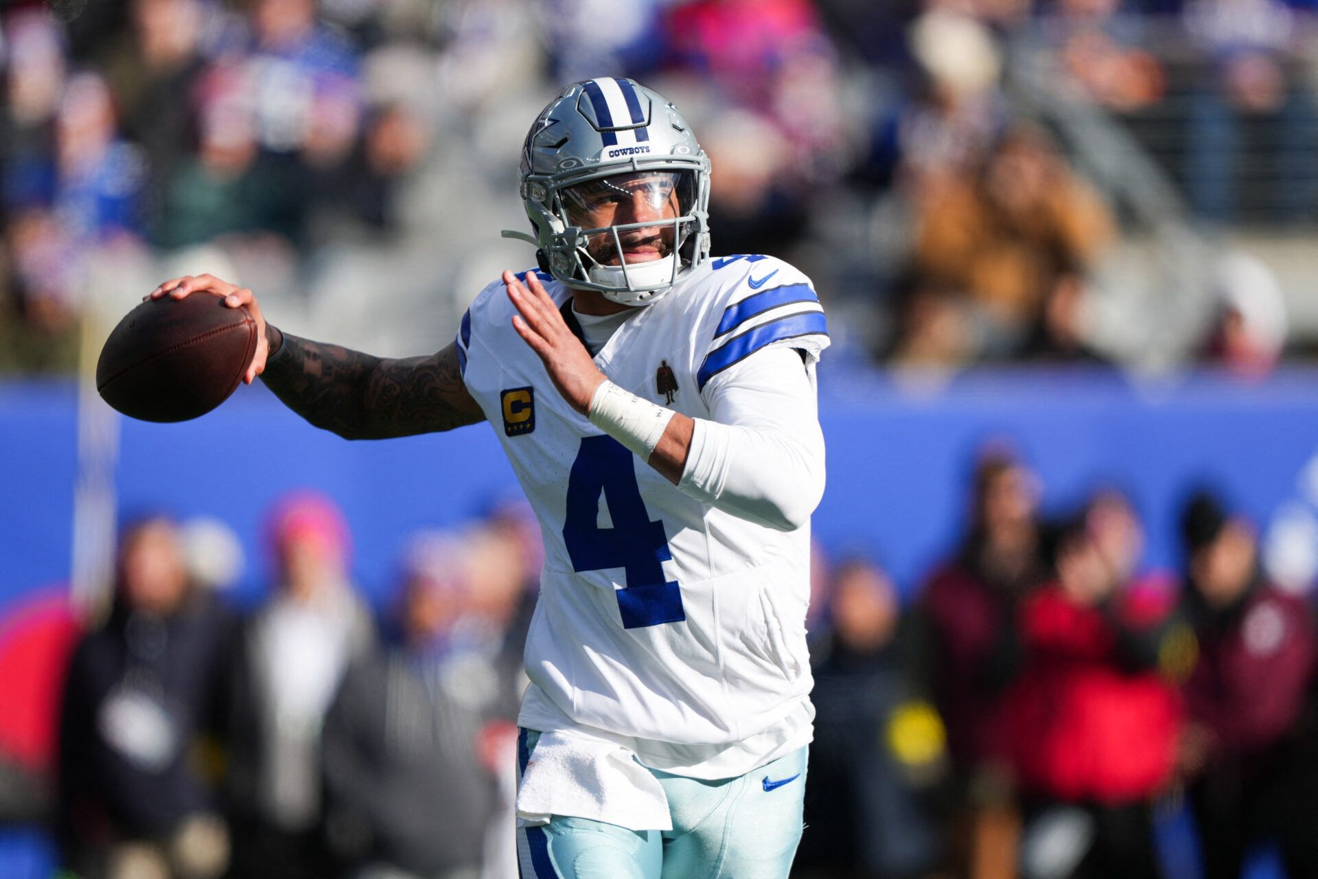 Dallas Cowboys quarterback Dak Prescott (4) looks to pass during the first quarter against the New York Giants at MetLife Stadium.