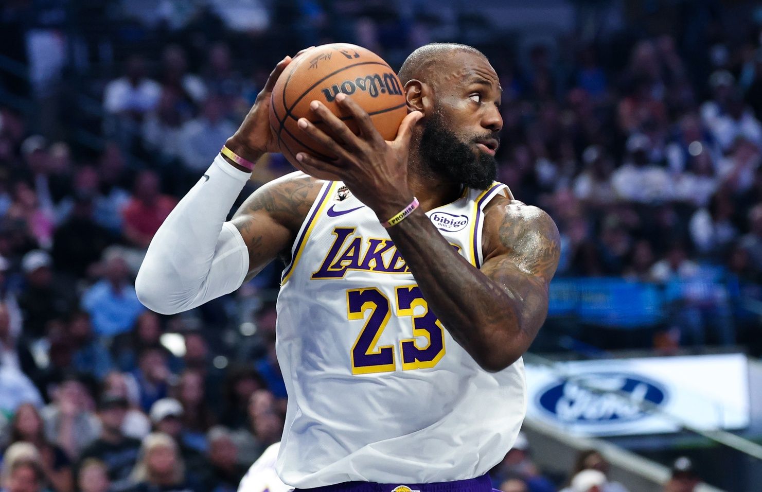 Los Angeles Lakers forward LeBron James (23) grabs a rebound during the first quarter against the Dallas Mavericks at American Airlines Center.