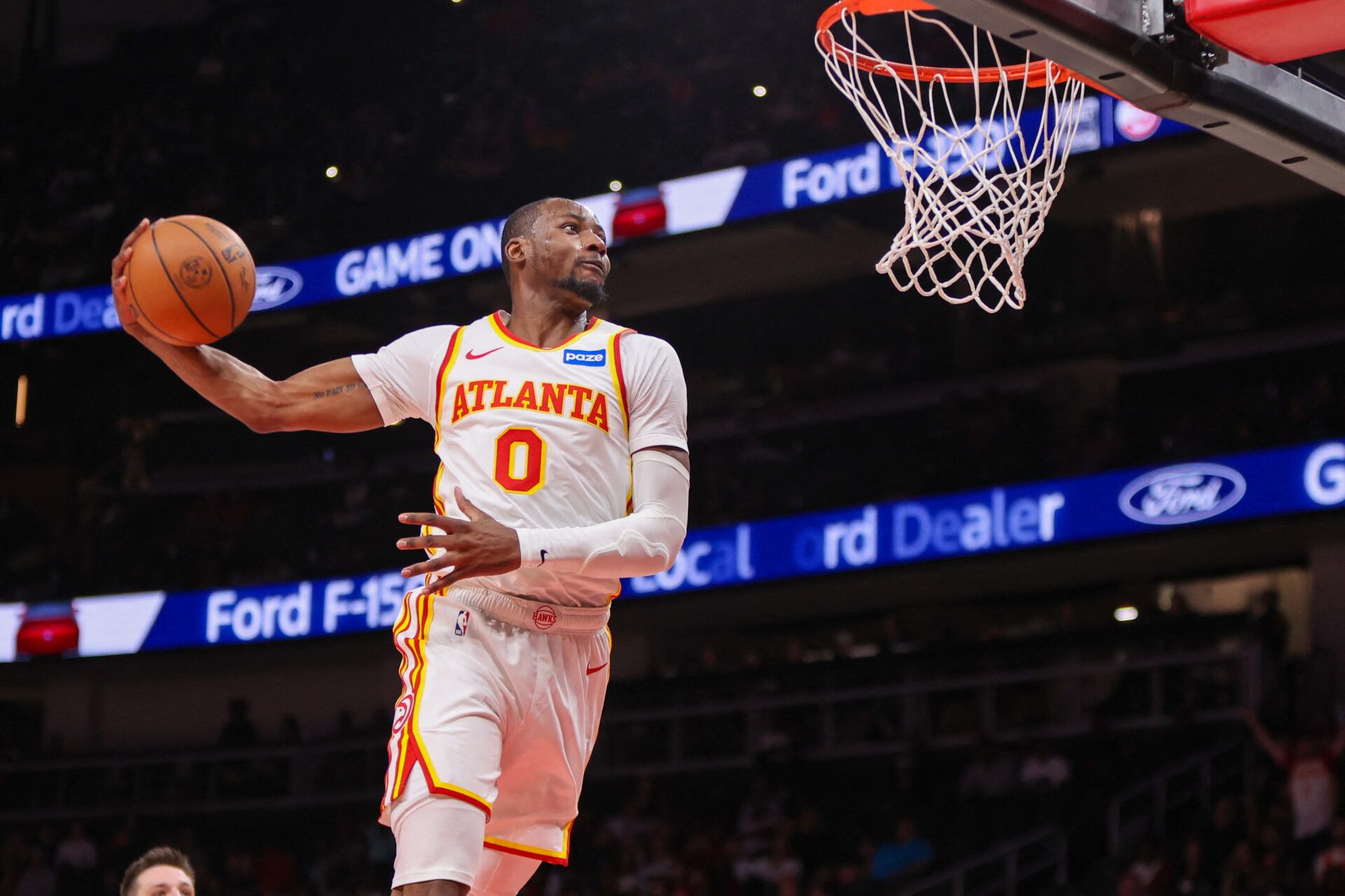 Atlanta Hawks forward Jonathan Kuminga (0) dunks against the Portland Trail Blazers in the fourth quarter at State Farm Arena.
