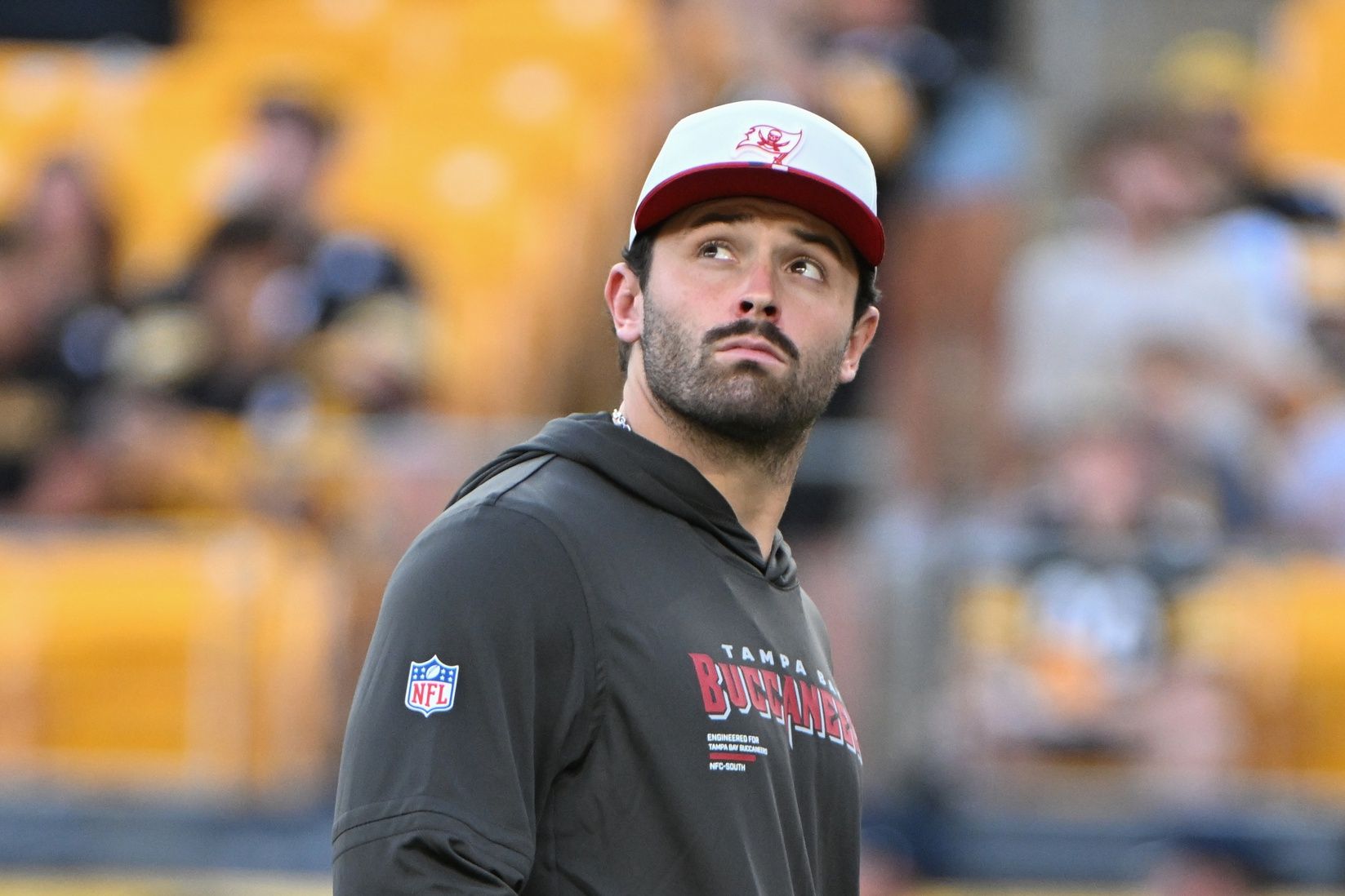 Tampa Bay Buccaneers quarterback Baker Mayfield (6) watches  warms up for a game against the Pittsburgh Steelers at Acrisure Stadium.