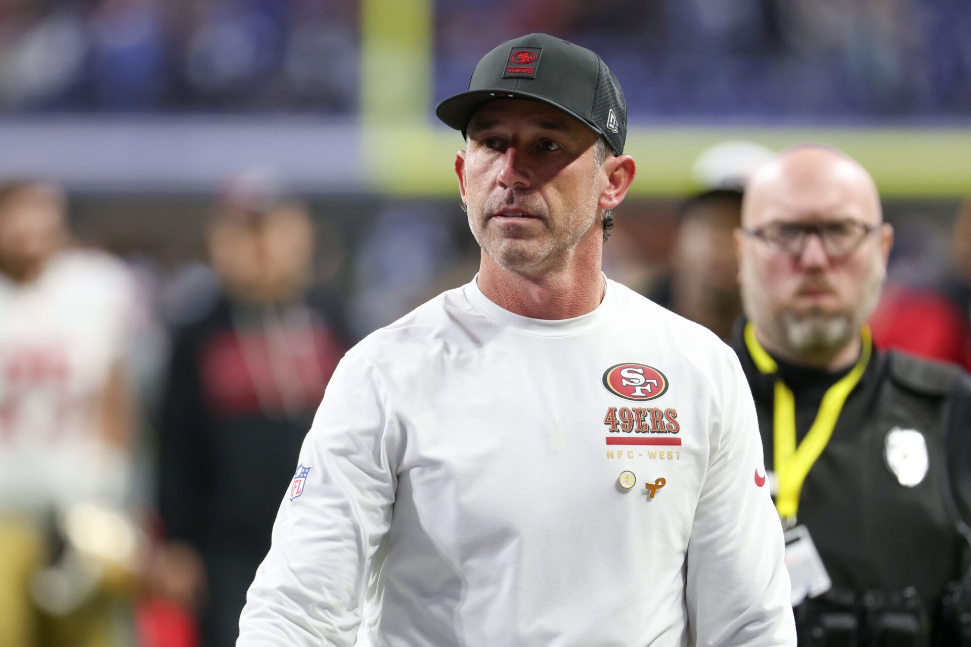San Francisco 49ers head coach Kyle Shanahan leaves the field after the game against the Indianapolis Colts at Lucas Oil Stadium.