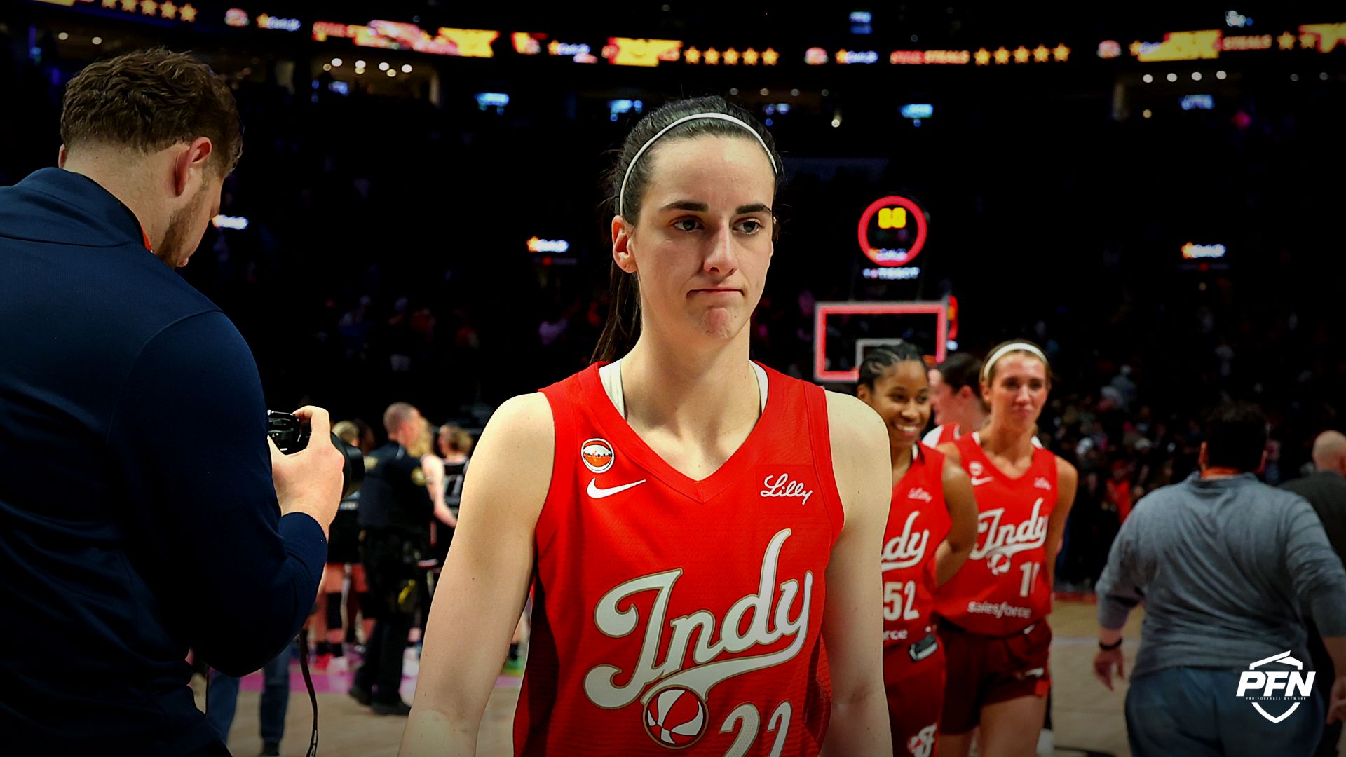 Indiana Fever guard Caitlin Clark (22) walks off the court after registering a triple double in a game against the Portland Fire at Moda Center.