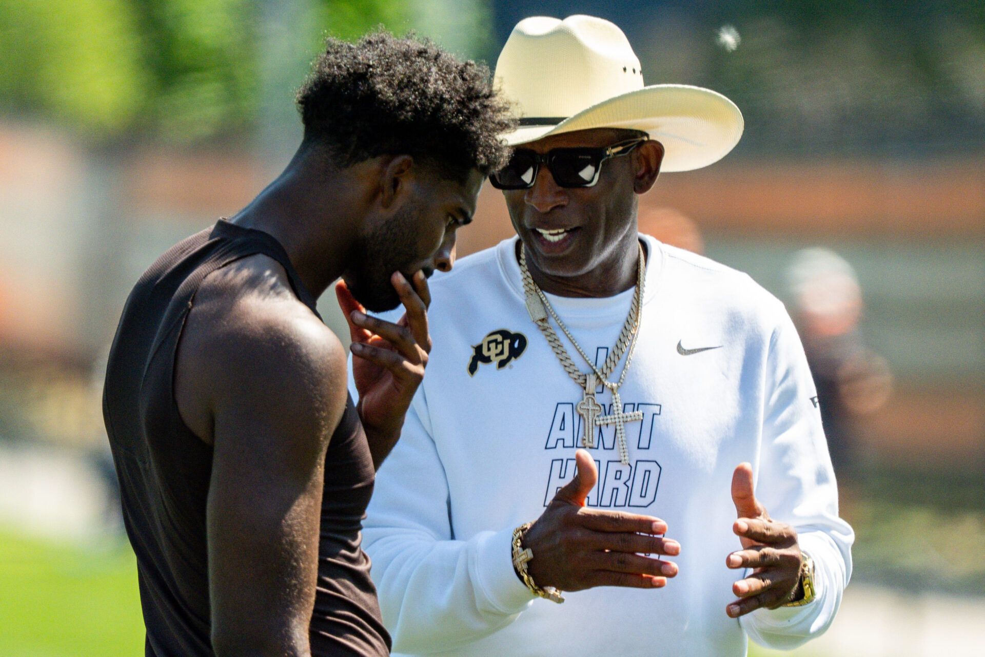 Deion Sanders spends time with his son, Cleveland Browns quarterback Shedeur Sanders (2) at the conclusion of the second day of training camp, July 30, 2026, in Berea, Ohio.
