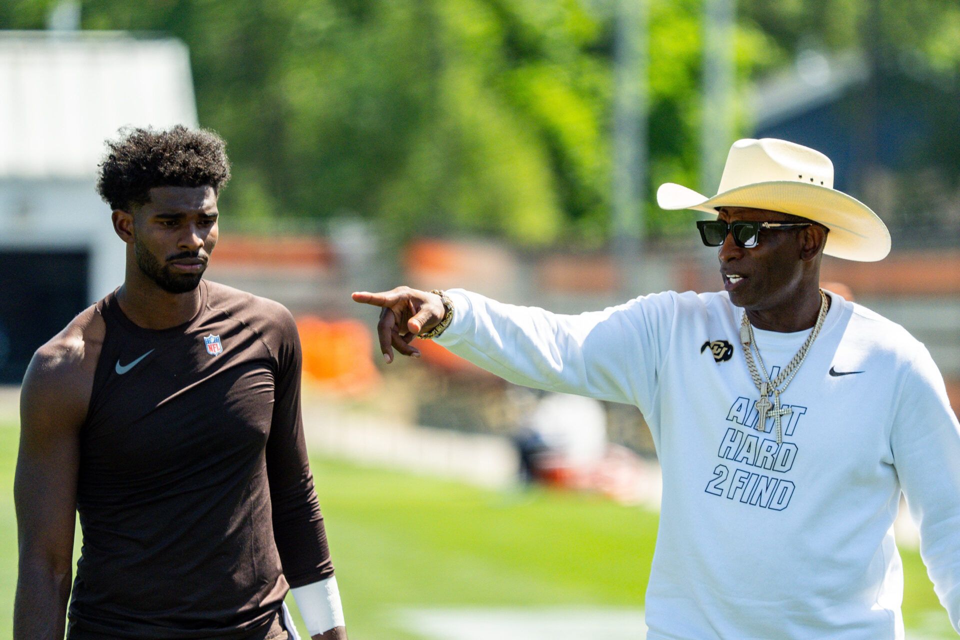 Deion Sanders spends time with his son, Cleveland Browns quarterback Shedeur Sanders (2) at the conclusion of the second day of training camp, July 30, 2026, in Berea, Ohio.