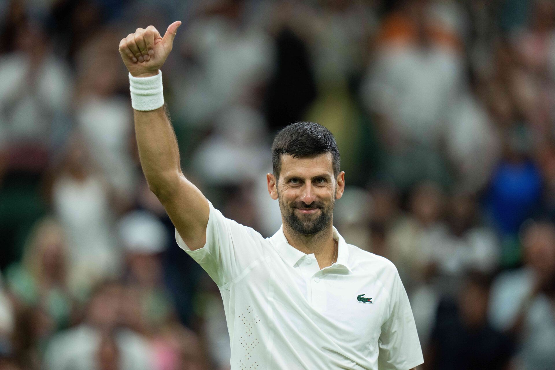 Novak Djokovic of Serbia celebrates winning his match against Stefanos Tsitsipas of Greece on day three at All England Lawn Tennis and Croquet Club.