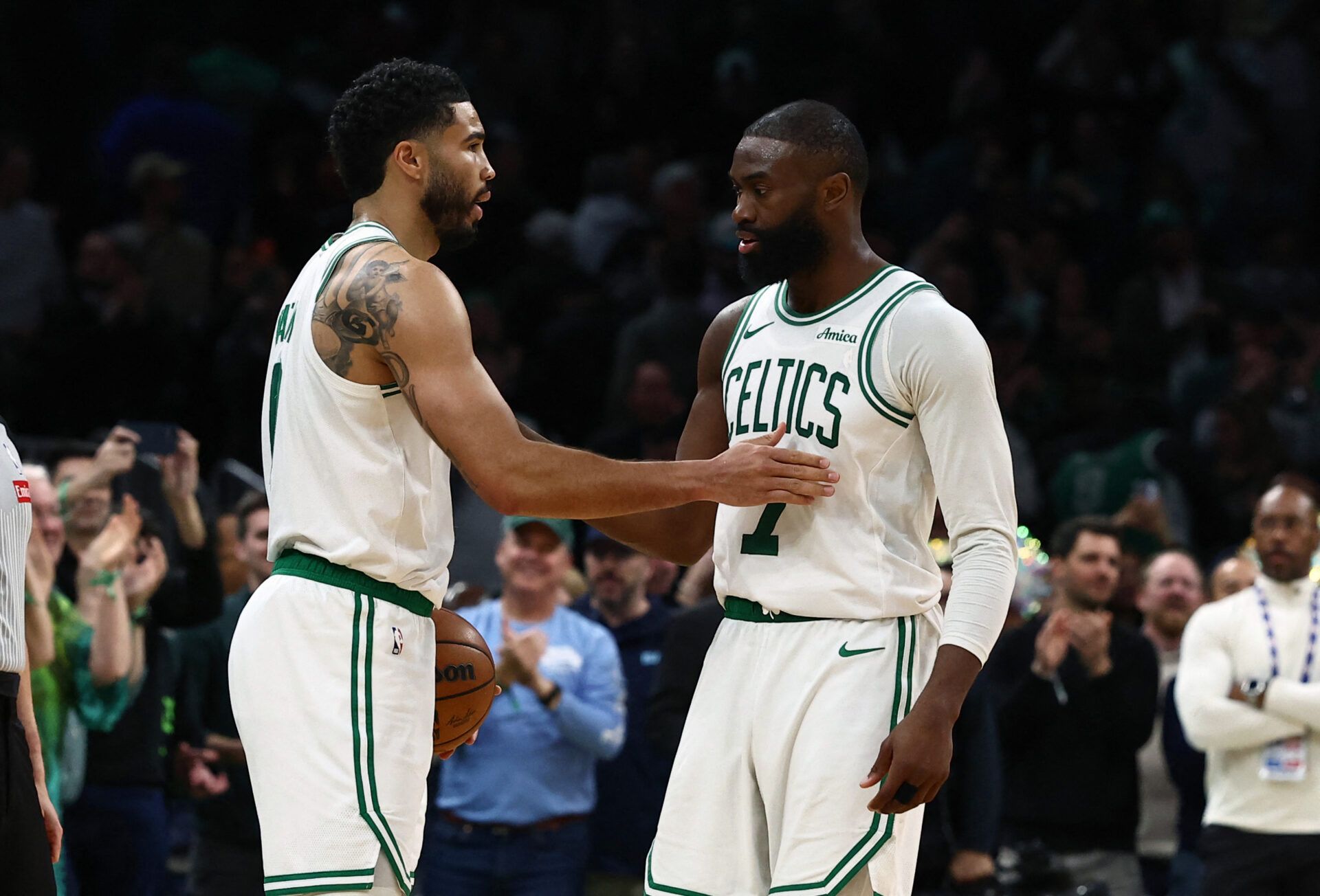 Boston Celtics guard Jaylen Brown (7) and forward Jayson Tatum (0) congratulate each other in the final seconds of the fourth quarter of their win over the Oklahoma City Thunder at TD Garden.
