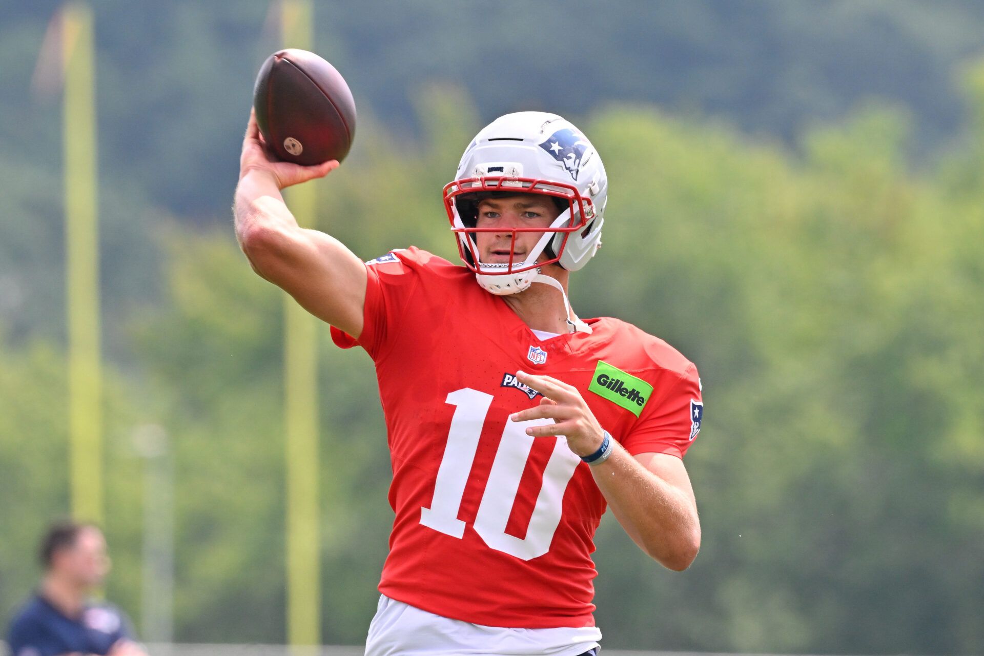New England Patriots quarterback Drake Maye (10) throws a pass during training camp at Gillette Stadium.