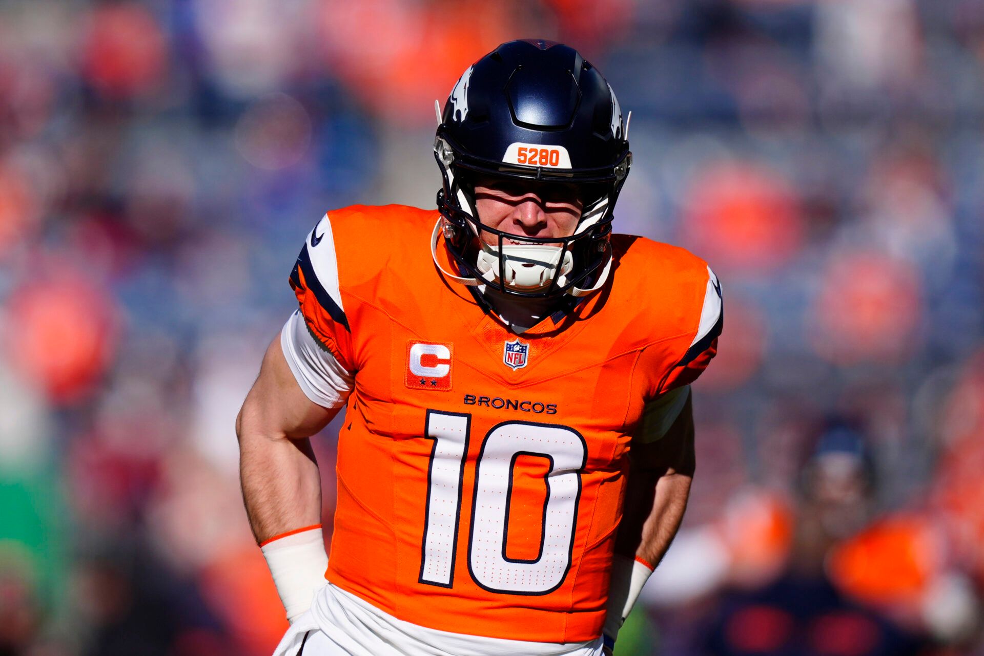 Denver Broncos quarterback Bo Nix (10) warms up before an AFC Divisional Round playoff game against the Buffalo Bills at Empower Field at Mile High.