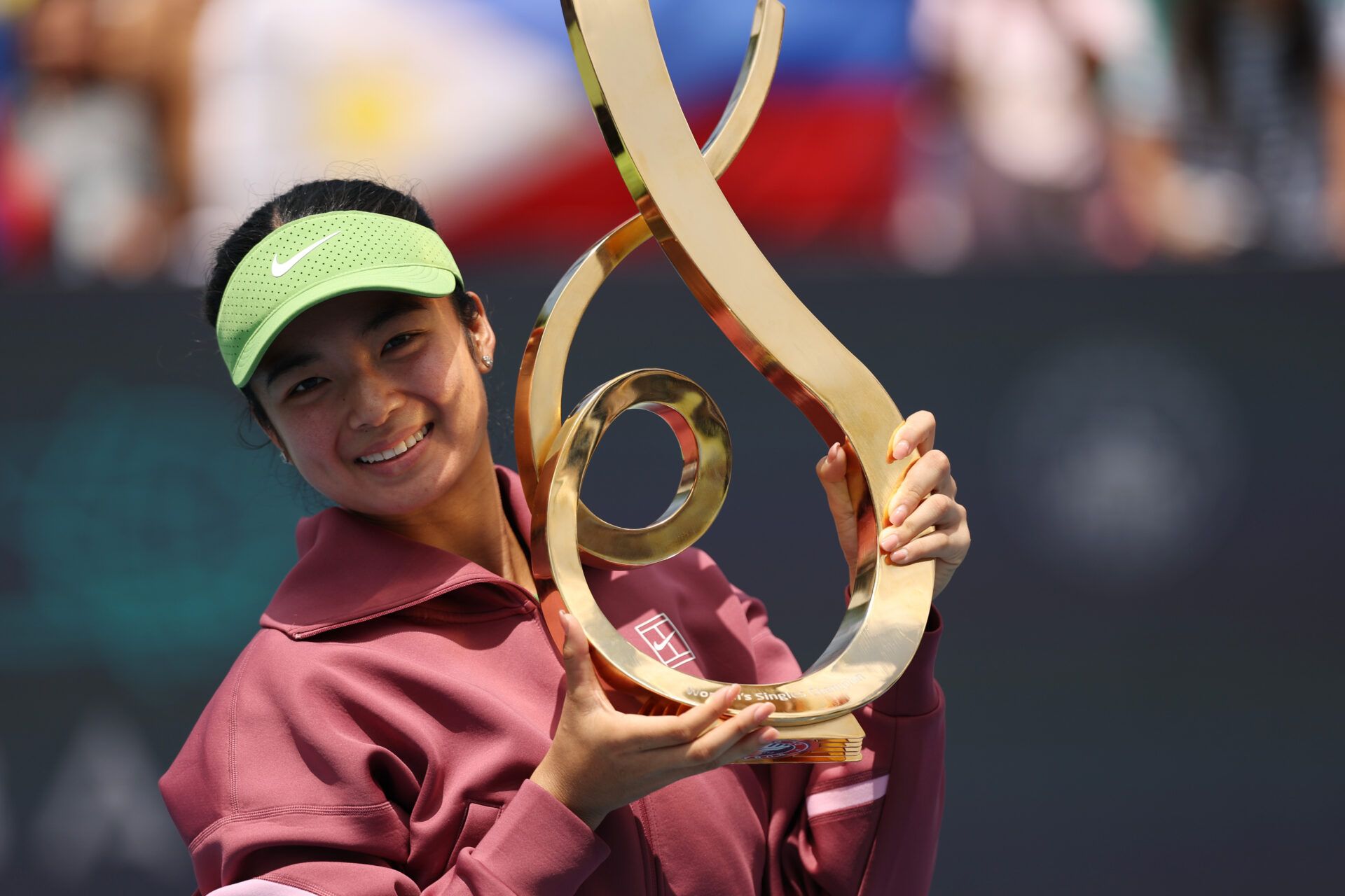 Alexandra Eala (PHI) celebrates with the championship trophy after her match against Jessica Pegula (USA) (not pictured) in the women's singles final of the 2026 Mubadala DC Open at Rock Creek Park Tennis Center.
