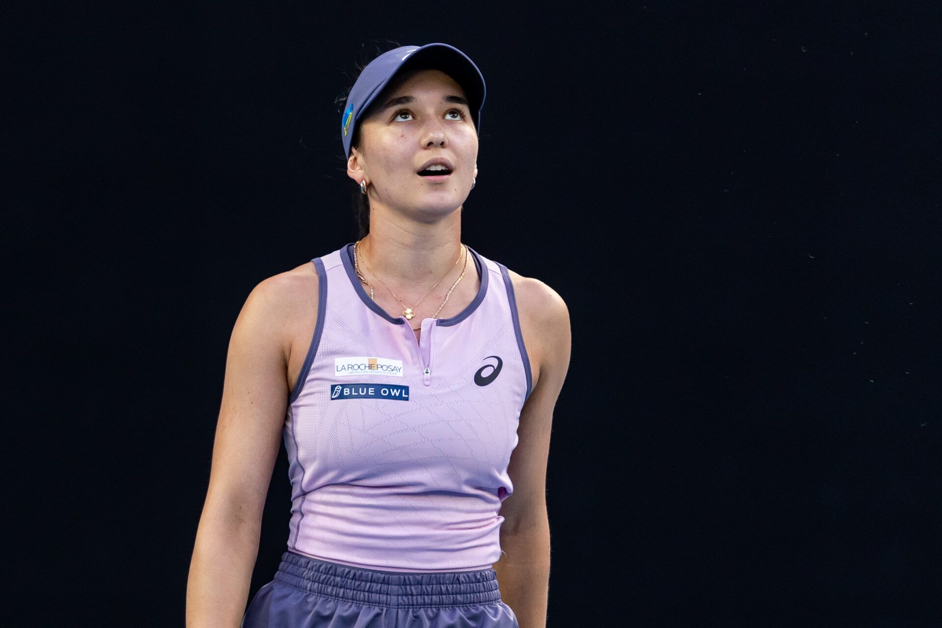 Eva Lys of Germany gestures during her match against Iga Swiatek of Poland in the fourth round of the women's singles at the 2025 Australian Open at Melbourne Park.