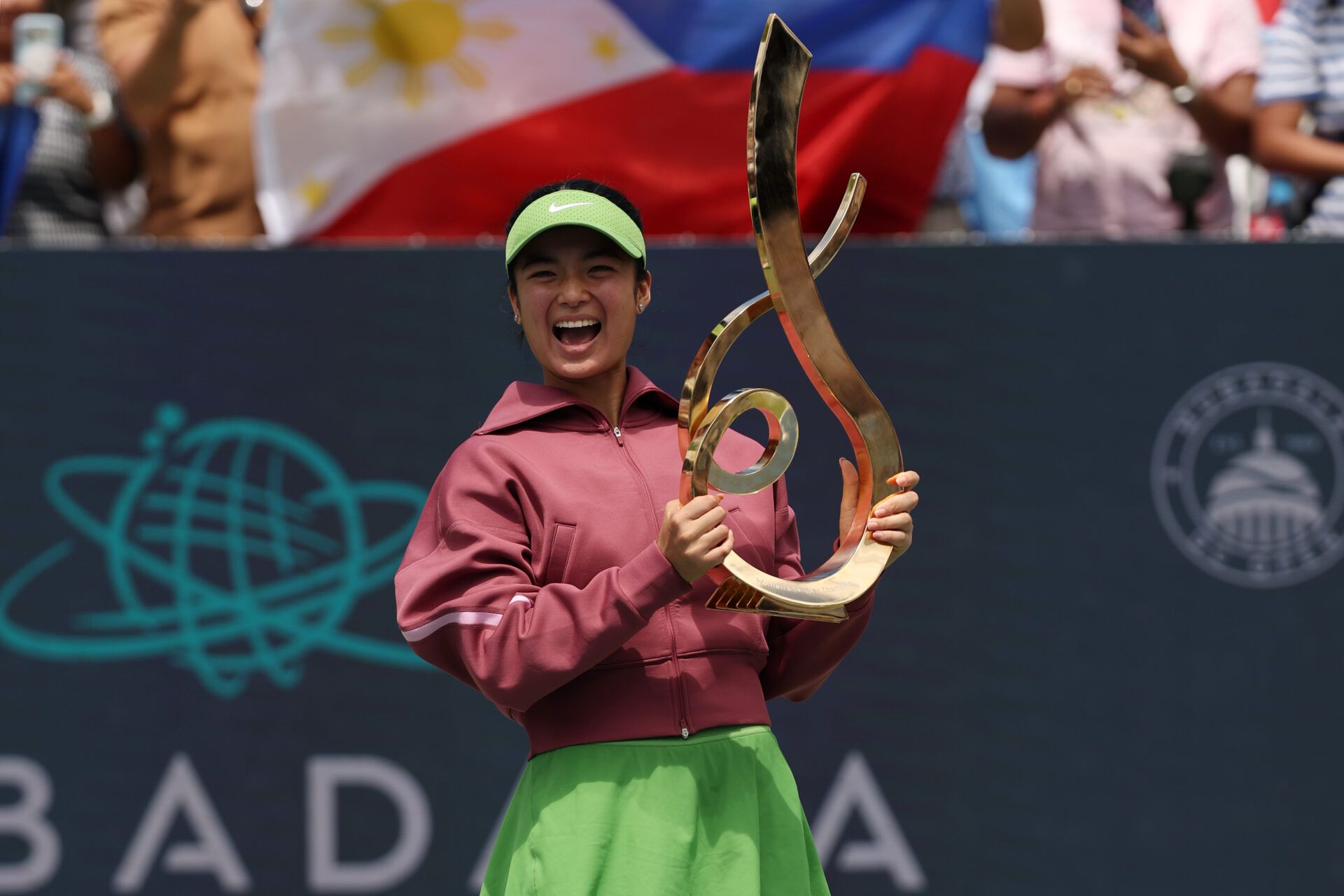 Alexandra Eala (PHI) celebrates with the championship trophy after her match against Jessica Pegula (USA) (not pictured) in the women's singles final of the 2026 Mubadala DC Open at Rock Creek Park Tennis Center.
