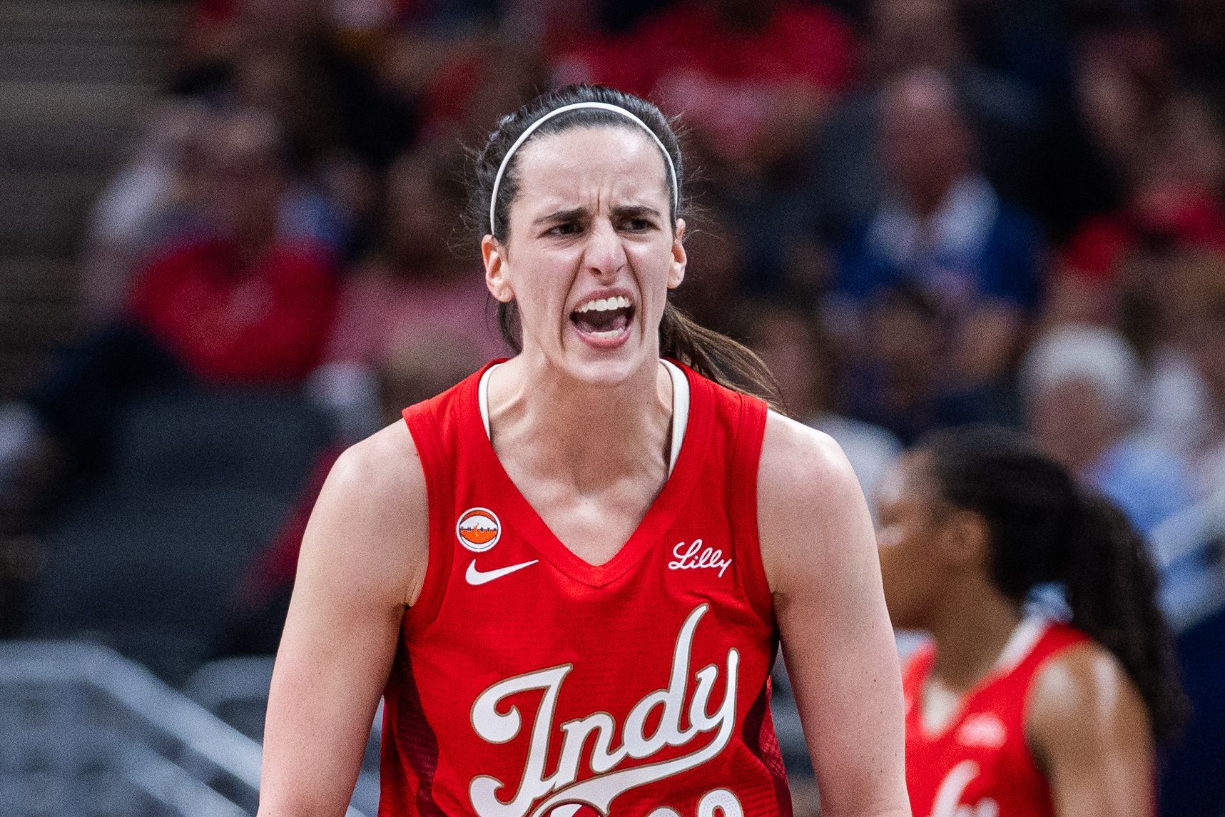 Indiana Fever guard Caitlin Clark (22) reacts against the Seattle Storm during the first half at Gainbridge Fieldhouse.