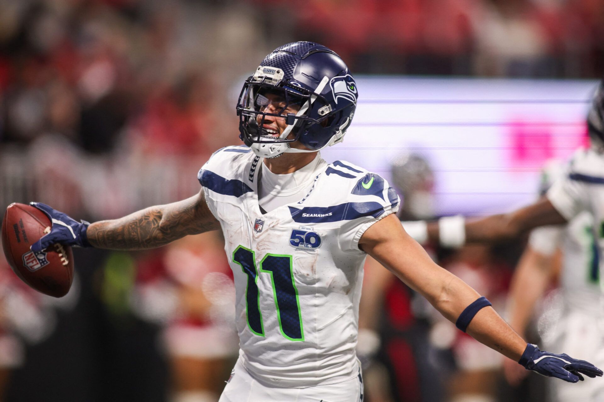 Seattle Seahawks wide receiver Jaxon Smith-Njigba (11) celebrates after a touchdown catch against the Atlanta Falcons in the fourth quarter at Mercedes-Benz Stadium.