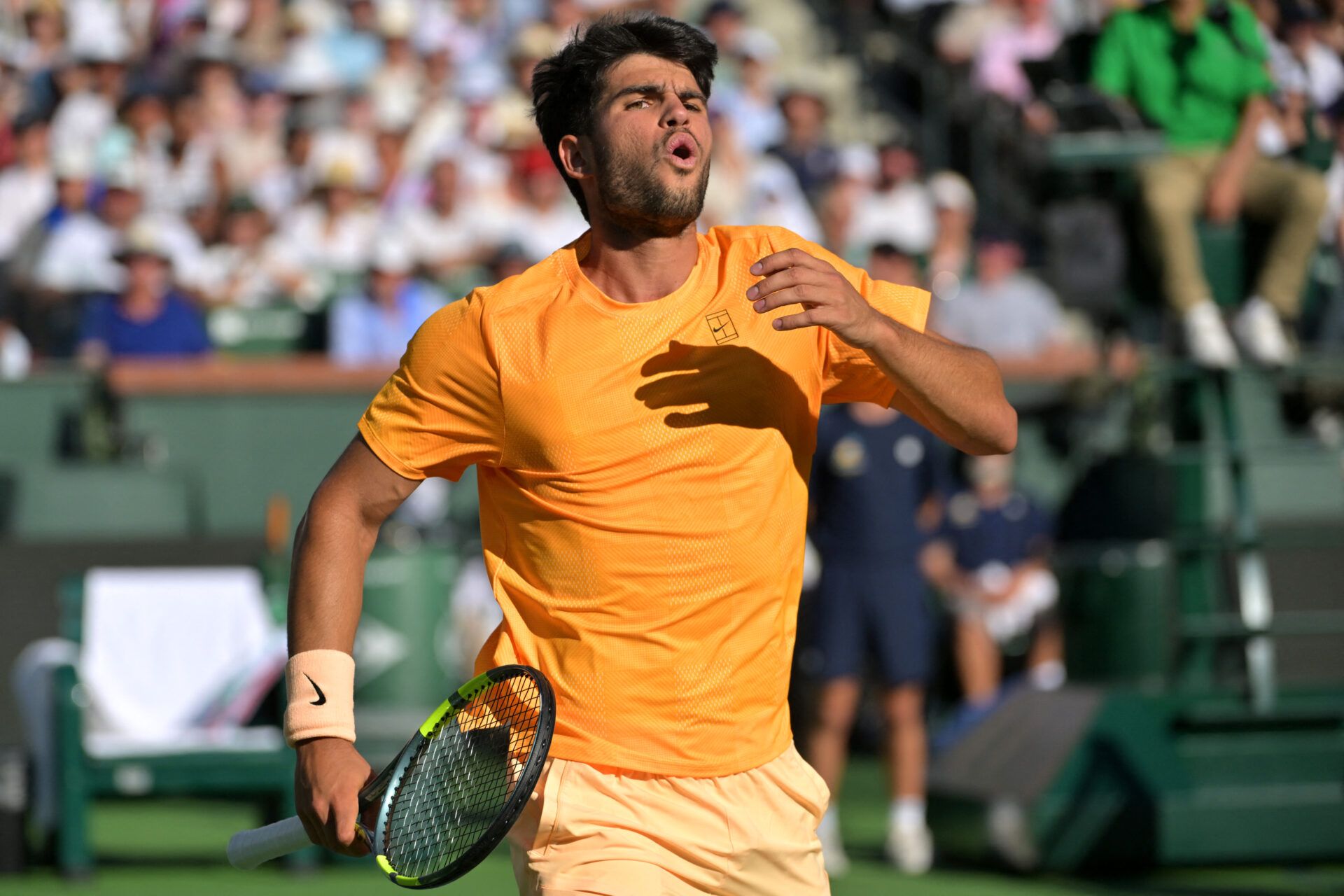 Carlos Alcaraz (ESP) reacts as a ball gets past him at the net during his semifinal match against Daniil Medvedev (RUS) in the BNP Paribas Open at the Indian Wells Tennis Garden.