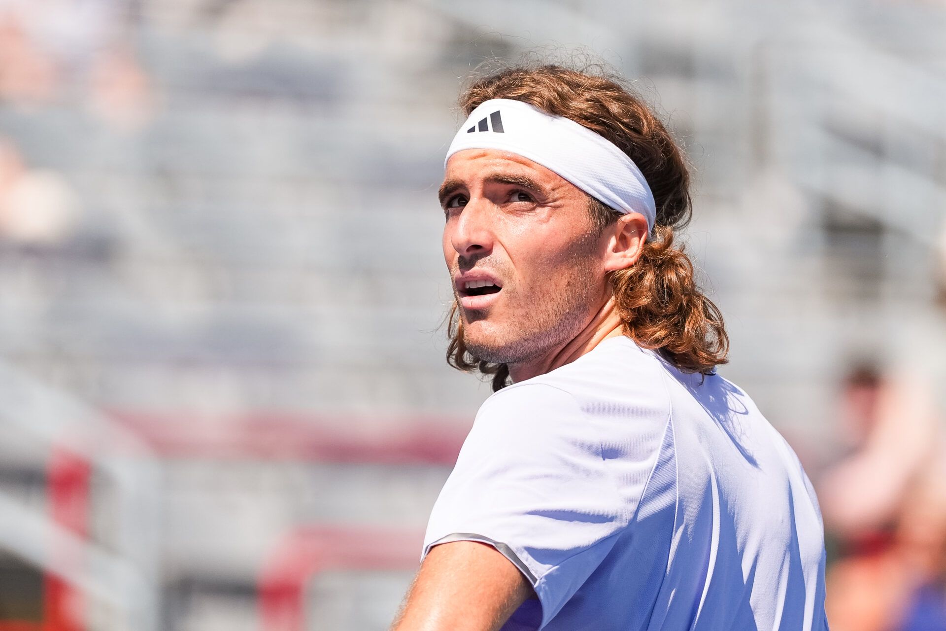 Stefanos Tsitsipas (GRE) looks on against Martin Damm (USA) in first round play at IGA Stadium.