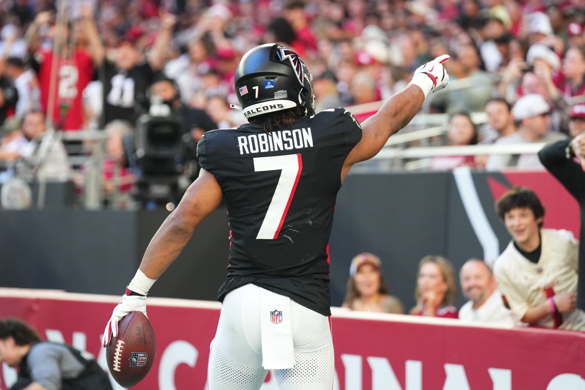 Atlanta Falcons running back Bijan Robinson (7) reacts after scoring a touchdown against the Arizona Cardinals during the first half at State Farm Stadium.