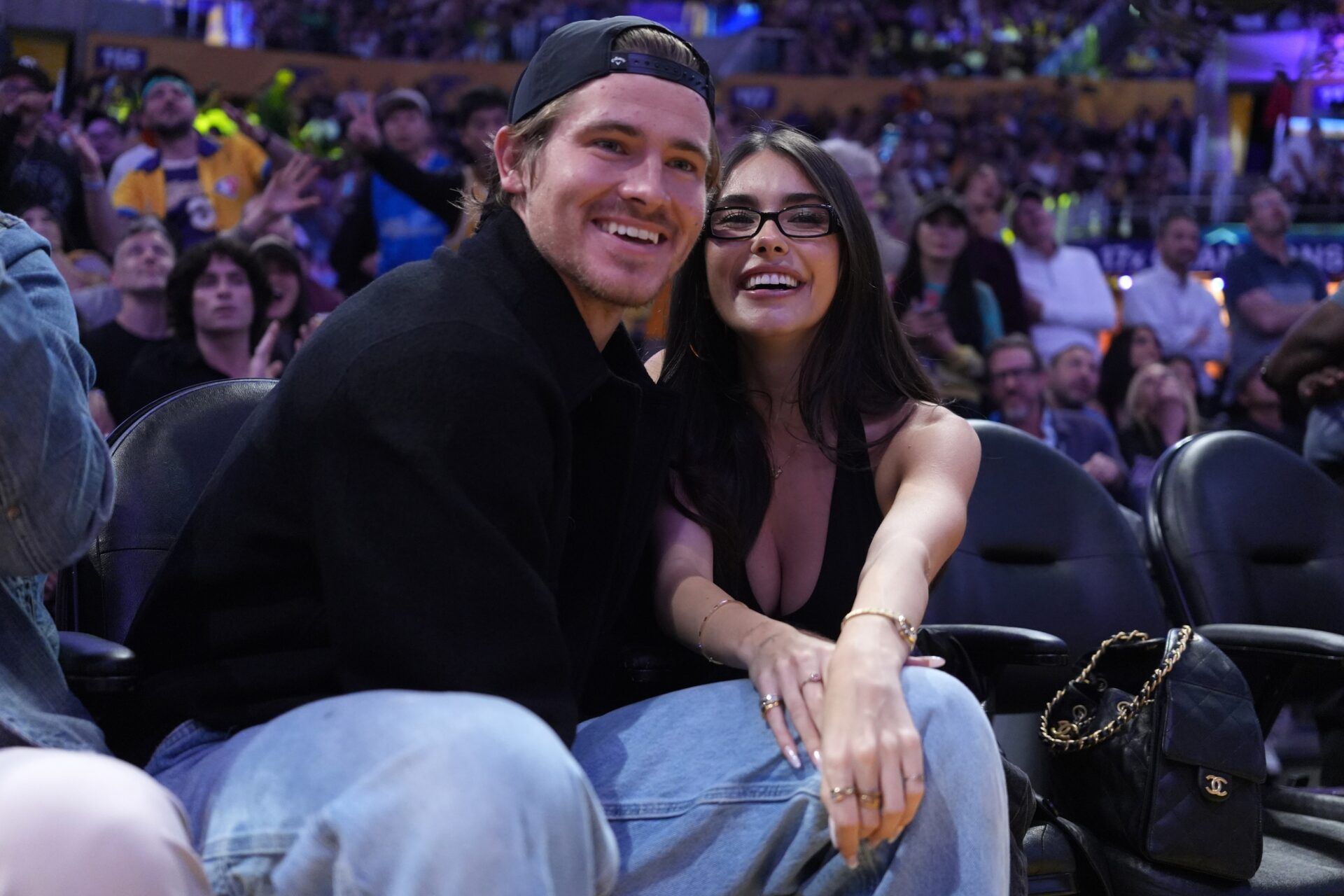 Los Angeles Chargers quarterback Justin Herbert (left) and girlfriend Madison Beer attend the game between the Minnesota Timberwolves and the Los Angeles Lakers at Crypto.com Arena.