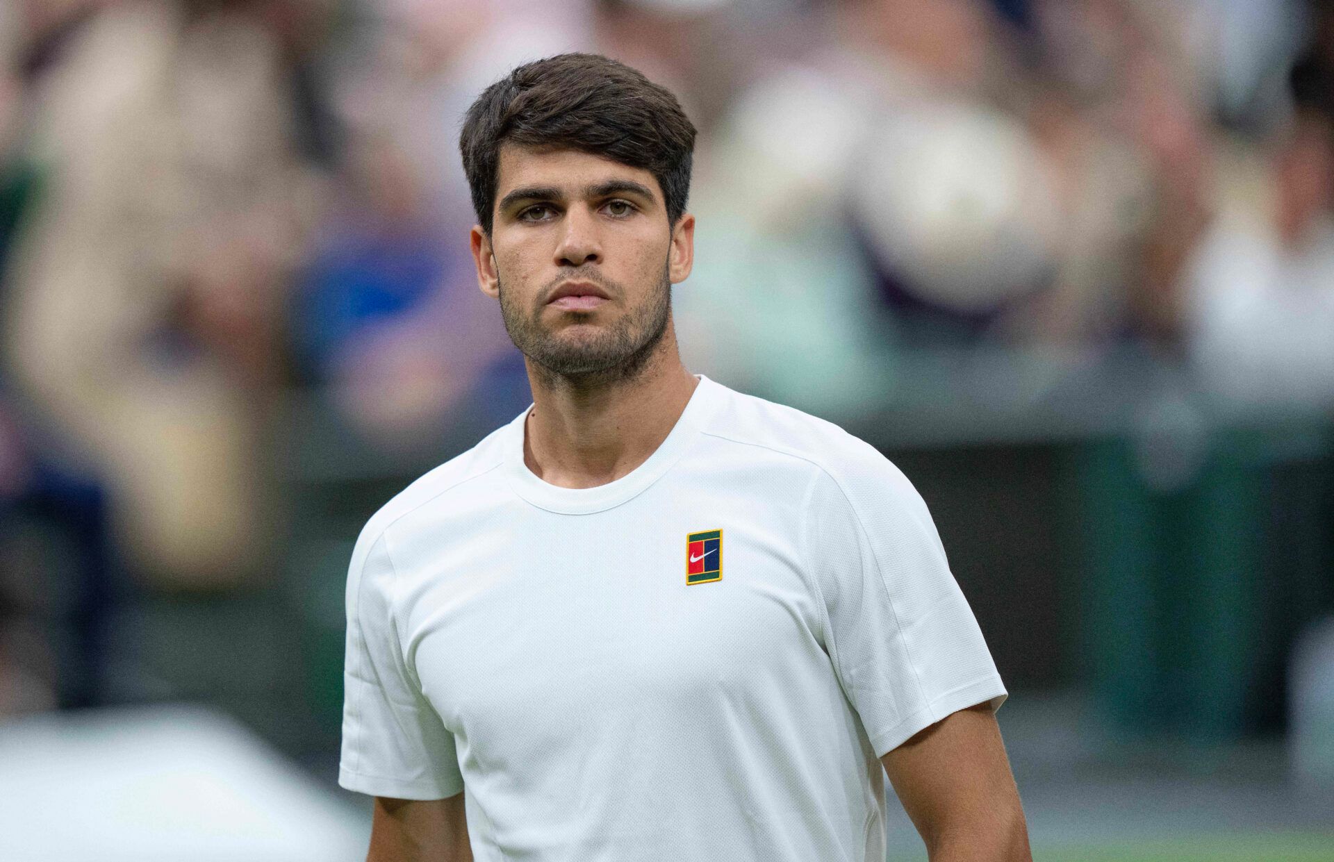 Carlos Alcaraz of Spain looks on during his match against Andrey Rublev on day seven at the All England Lawn Tennis and Croquet Club.
