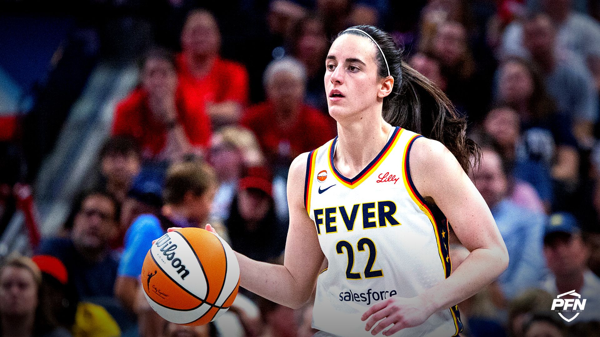 Indiana Fever guard Caitlin Clark (22) dribbles the ball  in the first half against the Connecticut Sun at Gainbridge Fieldhouse.