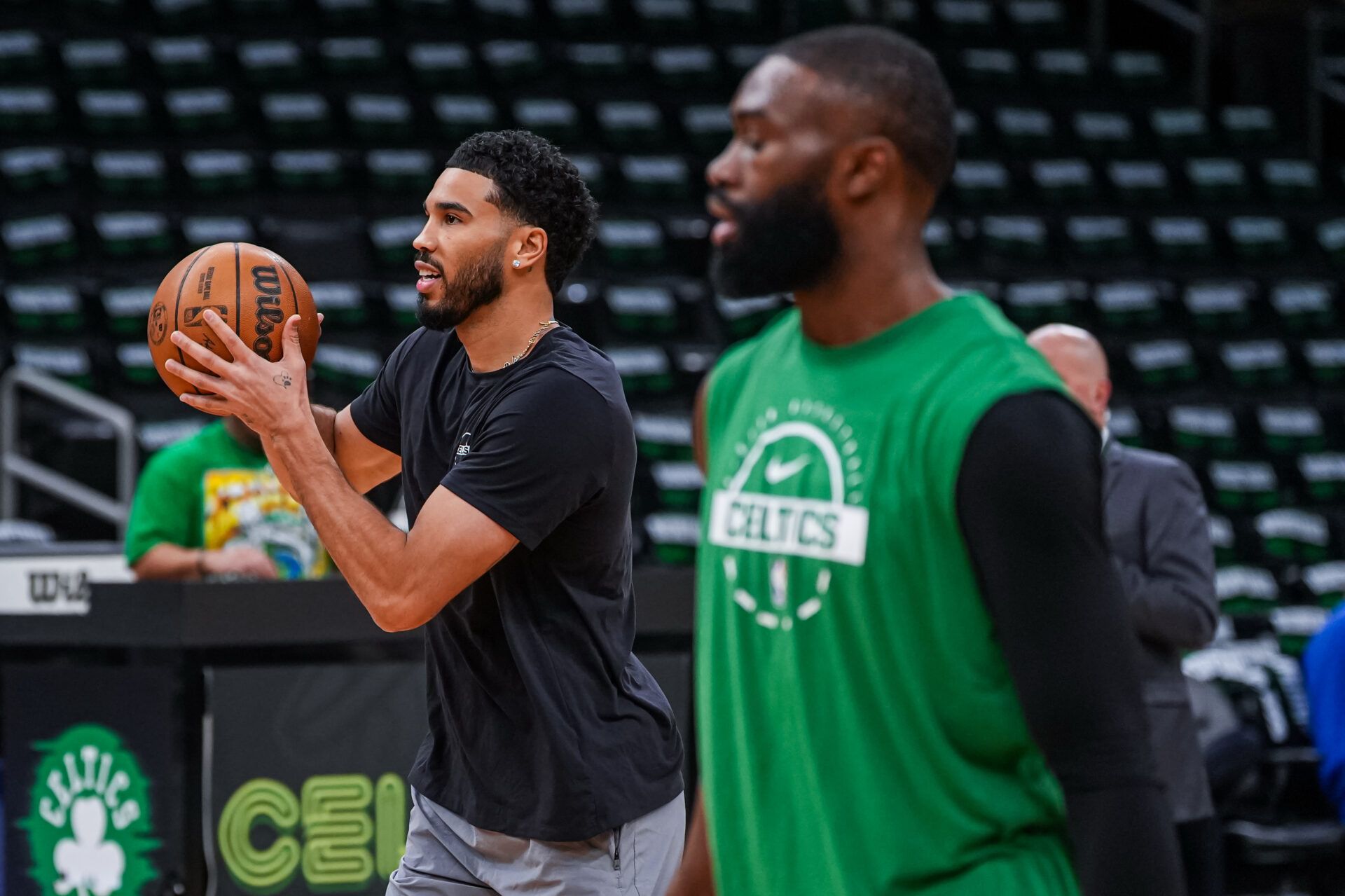 Boston Celtics forward Jayson Tatum (0) and guard Jaylen Brown (7) warm up before the start of the game against the Philadelphia 76ers in game five of the first round of the 2026 NBA Playoffs at TD Garden.