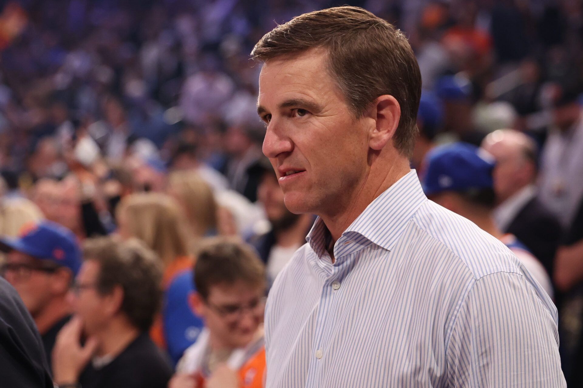 Two time Super Bowl MVP and former New York Giants quarterback Eli Manning stands courtside prior to the game between the New York Knicks and San Antonio Spurs in game three of the 2026 NBA Finals at Madison Square Garden.