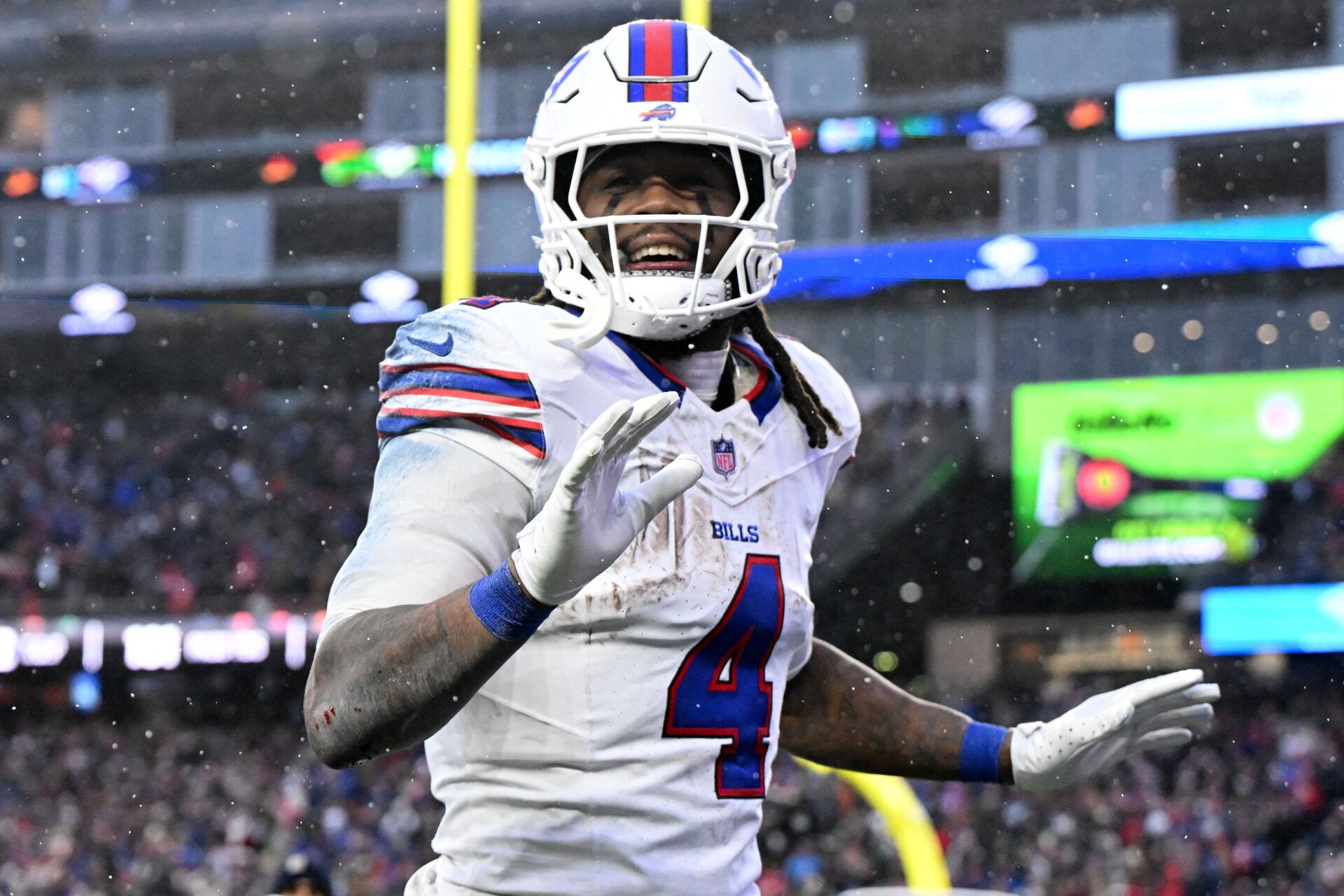 Buffalo Bills running back James Cook III (4) reacts after scoring a touchdown against the New England Patriots during the second half at Gillette Stadium.