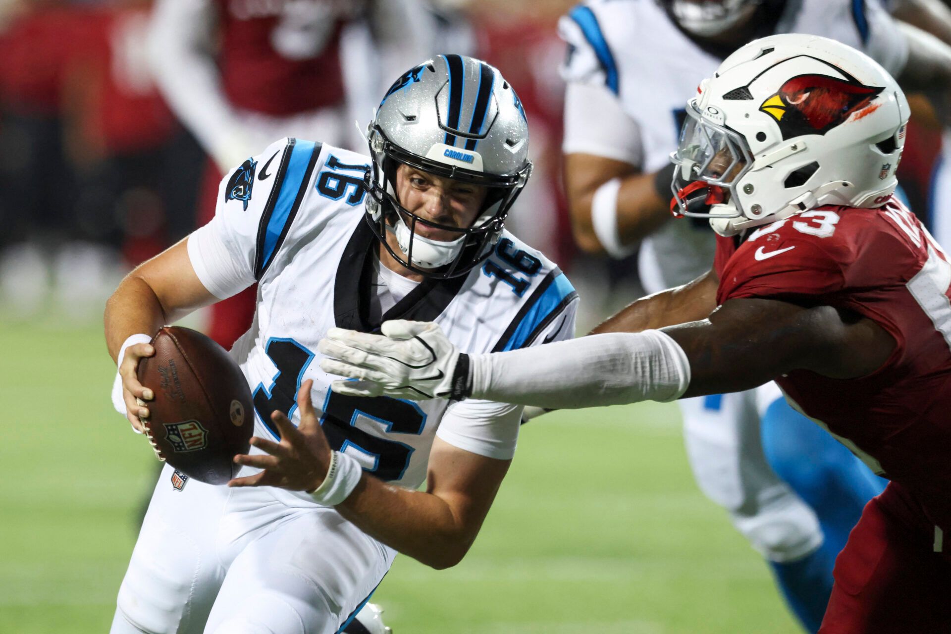 Carolina Panthers quarterback Haynes King (16) runs the ball against Arizona Cardinals linebacker Austin Keys (53) at Tom Benson Hall of Fame Stadium.