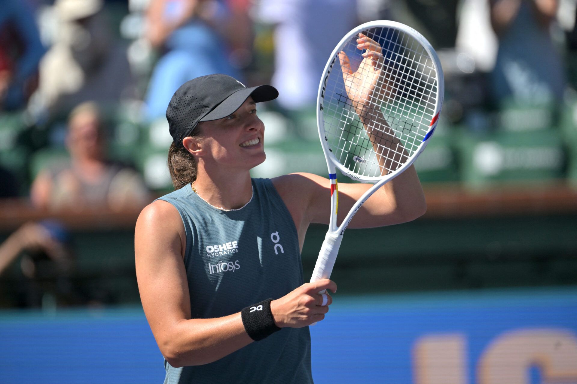 Iga Swiatek (POL) reacts after defeating Karolina Muchova (CZE) during the fourth round in the BNP Paribas Open at the Indian Wells Tennis Garden.