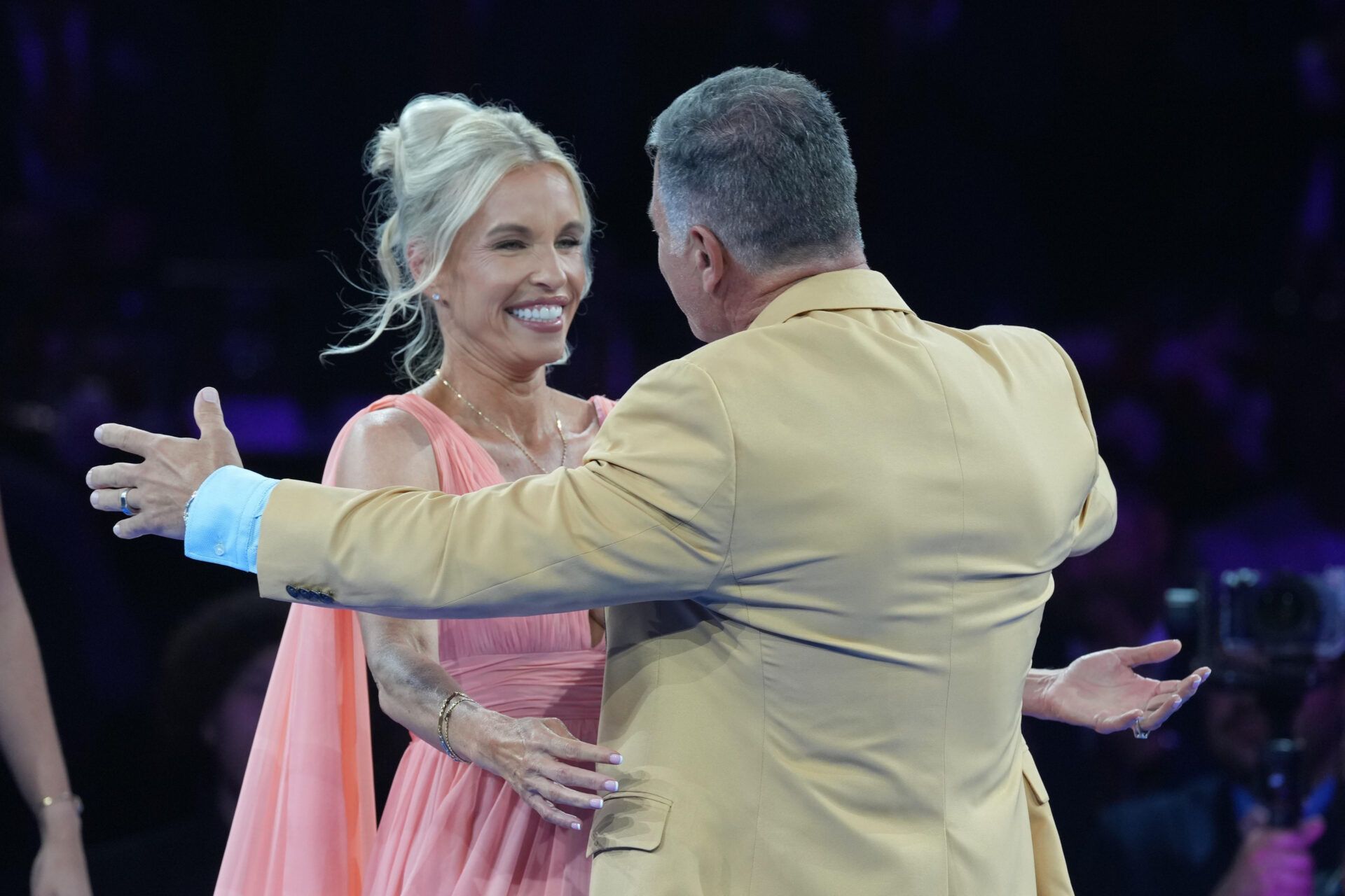 Adam Vinatieri (right) embraces wife Valeri Vinatieri during the Pro Football Hall of Fame Gold Jacket dinner at Canton Memorial Civic Center and Cultural Center.