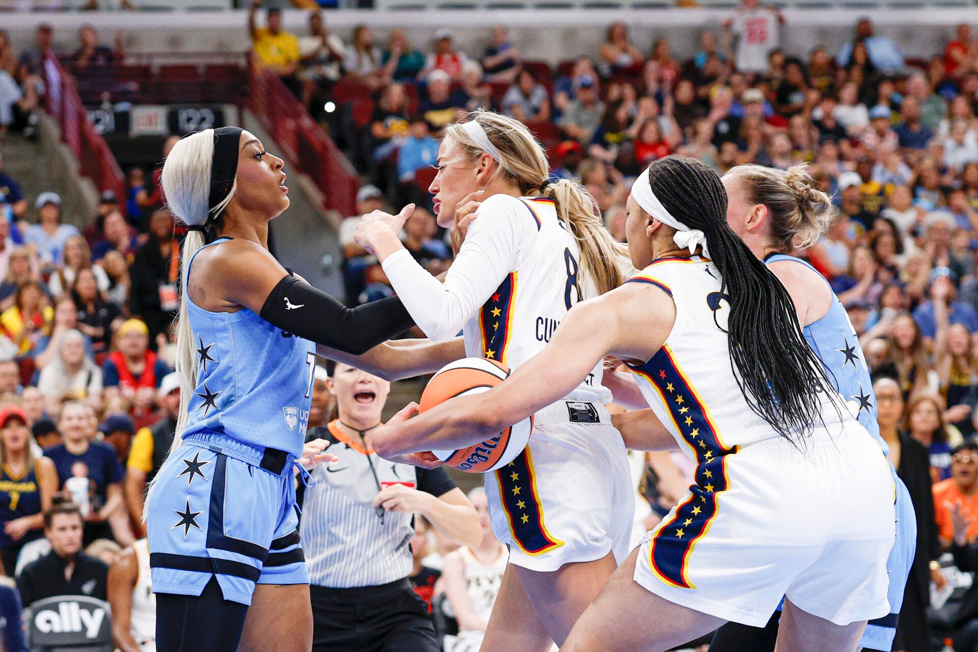 Indiana Fever guard Sophie Cunningham (8) fights with Chicago Sky guard DiJonai Carrington (7) after she was fouled during the first half at United Center.