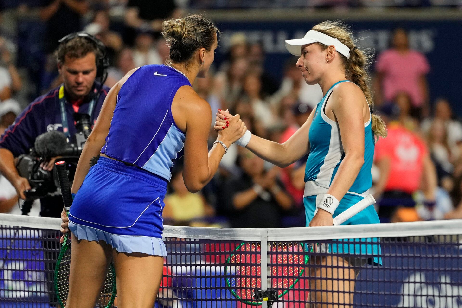 Aryna Sabalenka congratulates Ekaterina Alexandrova (right) on her win during the fourth round at the National Bank Open at Sobeys Stadium.