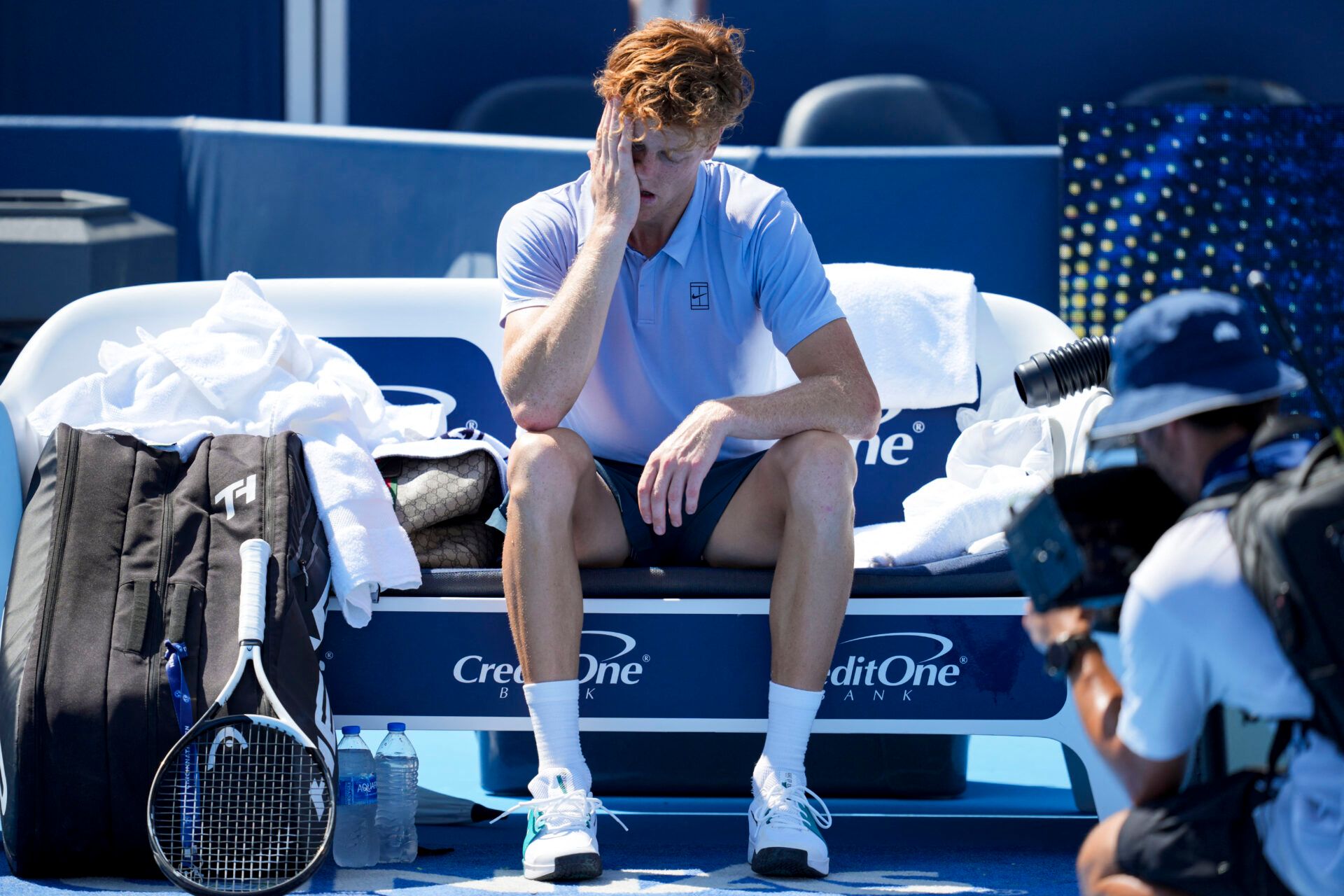 Jannik Sinner (ITA) sits on his bench after retiring from his match against Carlos Alcaraz (ESP) during the Cincinnati Open at the Lindner Family Tennis Center.
