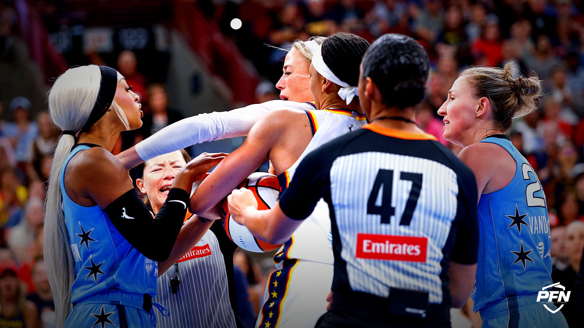 Indiana Fever guard Sophie Cunningham (8) fights with Chicago Sky guard DiJonai Carrington (7) after she was fouled during the first half at United Center.