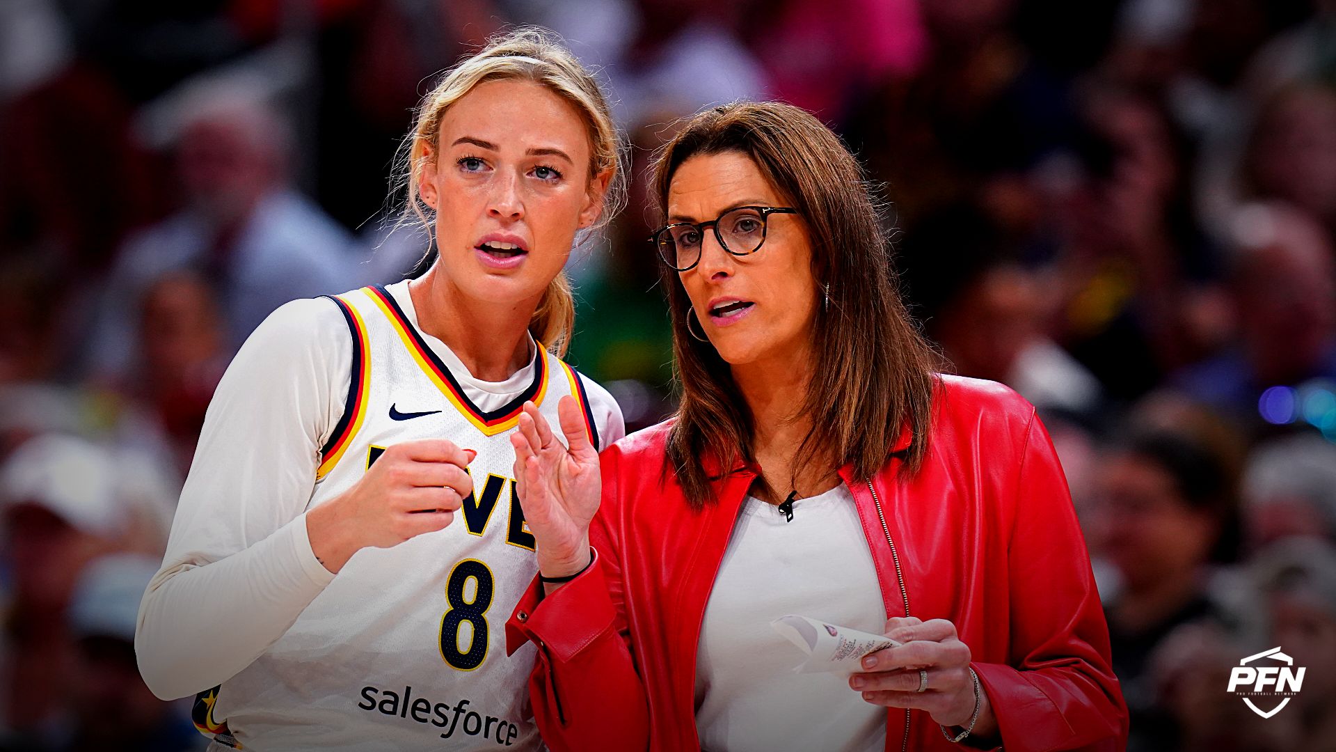 Indiana Fever head coach Stephanie White talks with guard Sophie Cunningham (8) from the sideline as they take on the Connecticut Sun at TD Garden.