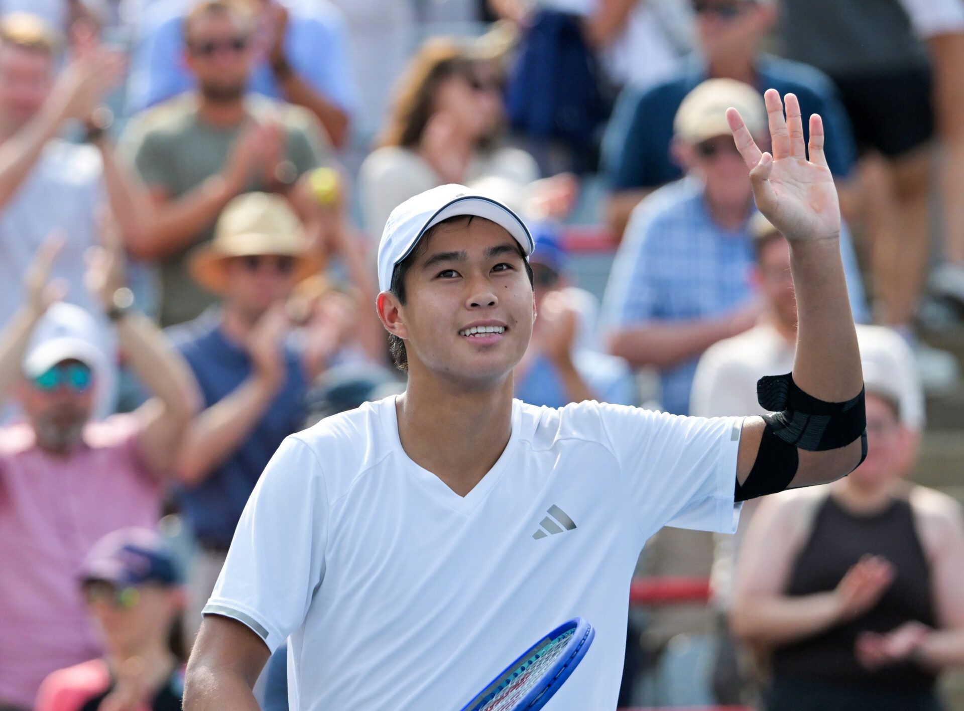 Learner Tien (USA) reacts after winning his match against Thiago Agustin Tirante (ARG) during round of sixteen play at IGA Stadium.