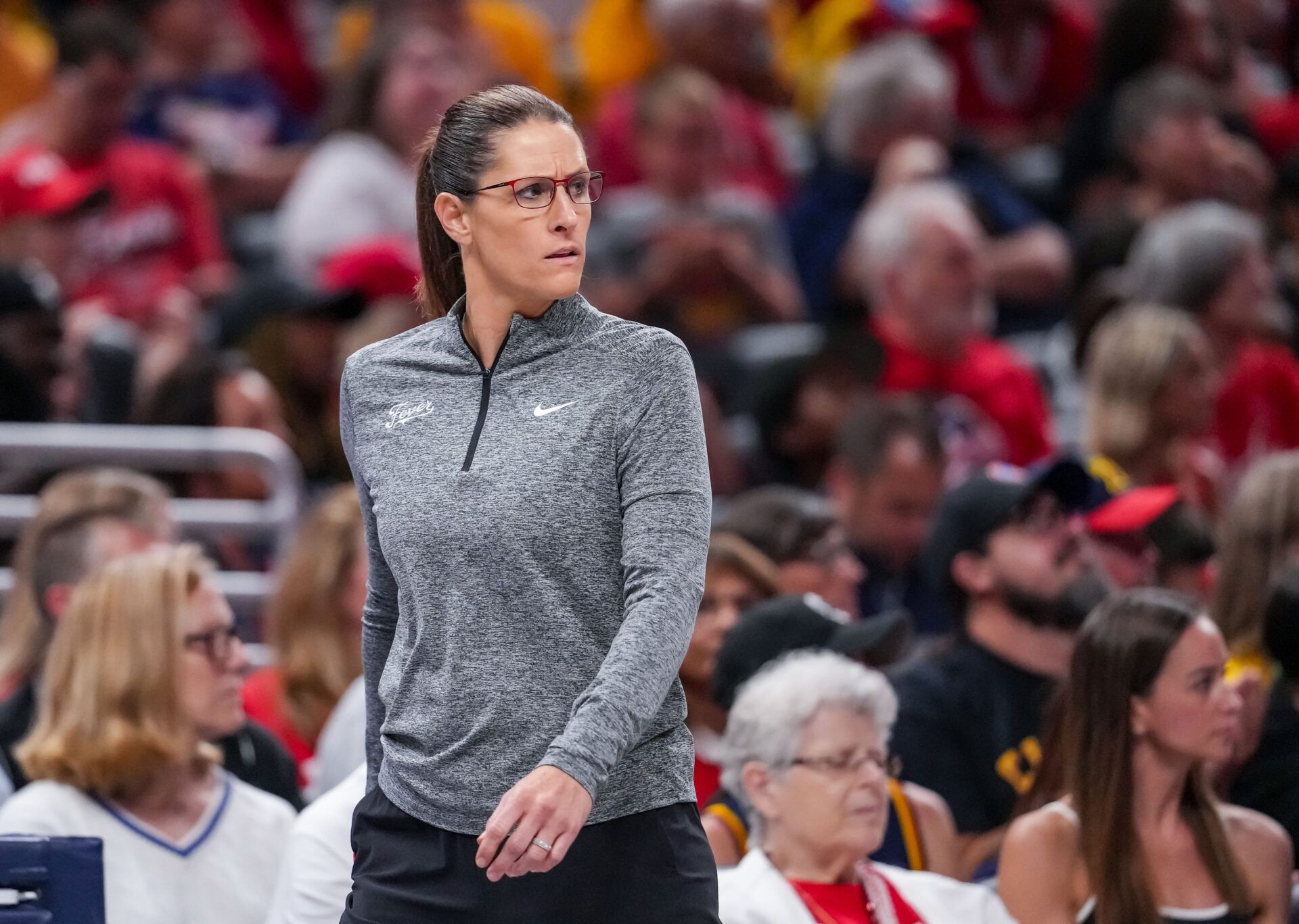 Indiana Fever head coach Stephanie White walks up the baseline Thursday, Aug. 6, 2026, during the game at Gainbridge Fieldhouse in Indianapolis. The Las Vegas Aces defeated the Indiana Fever in overtime, 86-84.