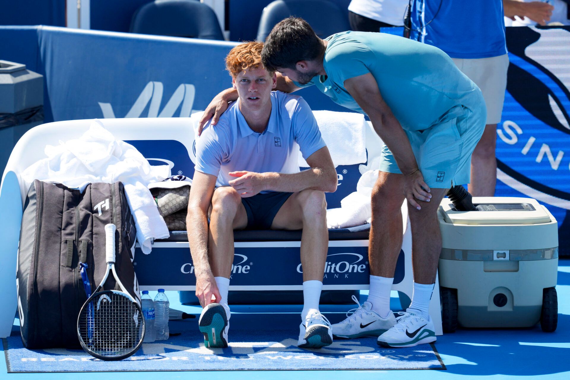 Jannik Sinner (ITA), left, talks with Carlos Alcaraz (ESP) after retiring from their match during the Cincinnati Open at the Lindner Family Tennis Center.