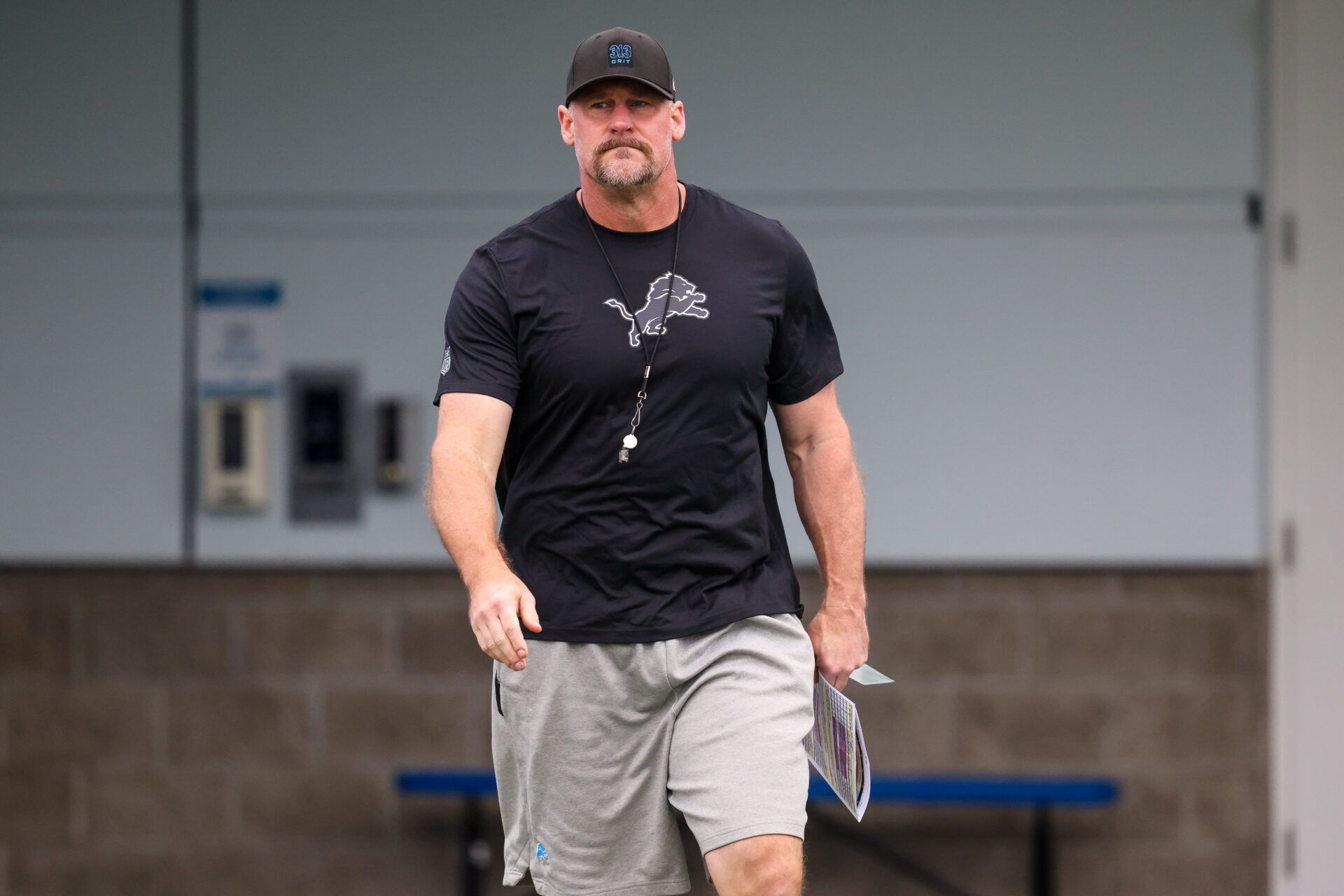 Detroit Lions head coach Dan Campbell walks onto the practice field at Meijer Performance Center.