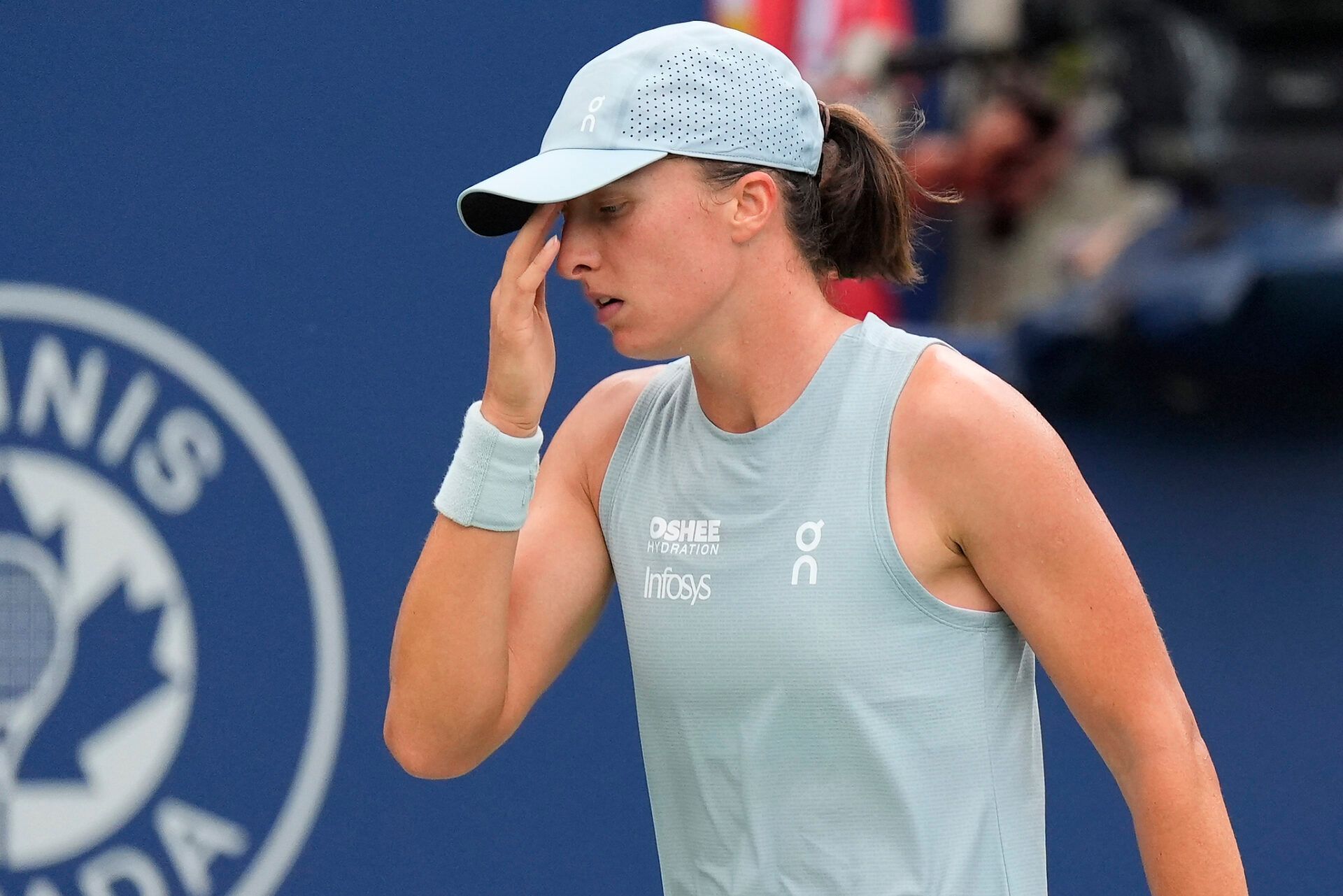 Iga Swiatek (POL) reaxcts after losing a pointl to Marta Kostyuk (not pictured) during the fourth round at the National Bank Open at Sobeys Stadium.