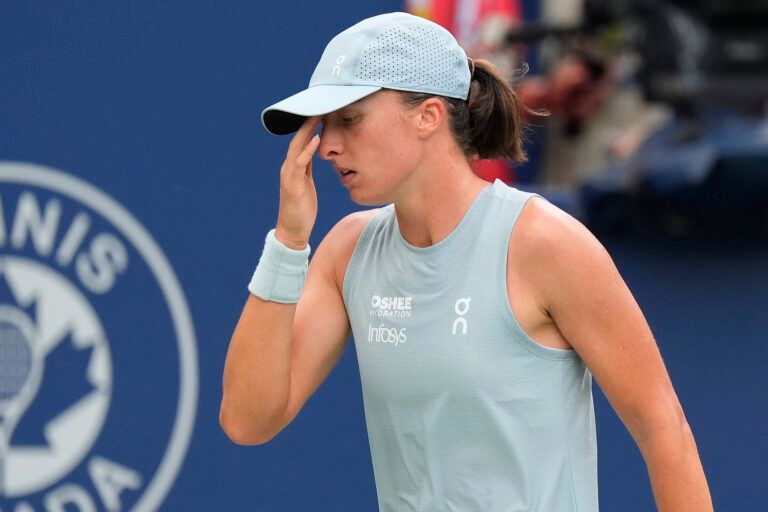 Iga Swiatek (POL) reaxcts after losing a pointl to Marta Kostyuk (not pictured) during the fourth round at the National Bank Open at Sobeys Stadium.