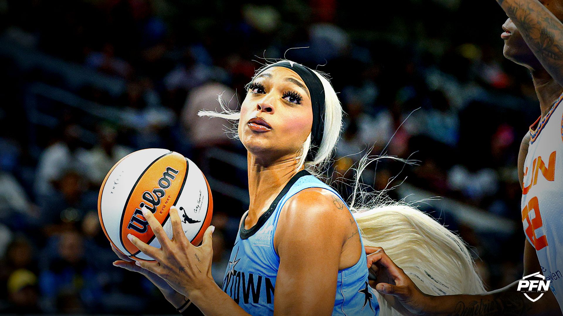 Chicago Sky guard-forward DiJonai Carrington (7) drives to the basket against Connecticut Sun guard Saniya Rivers (22) during the second half of a WNBA game at Wintrust Arena.