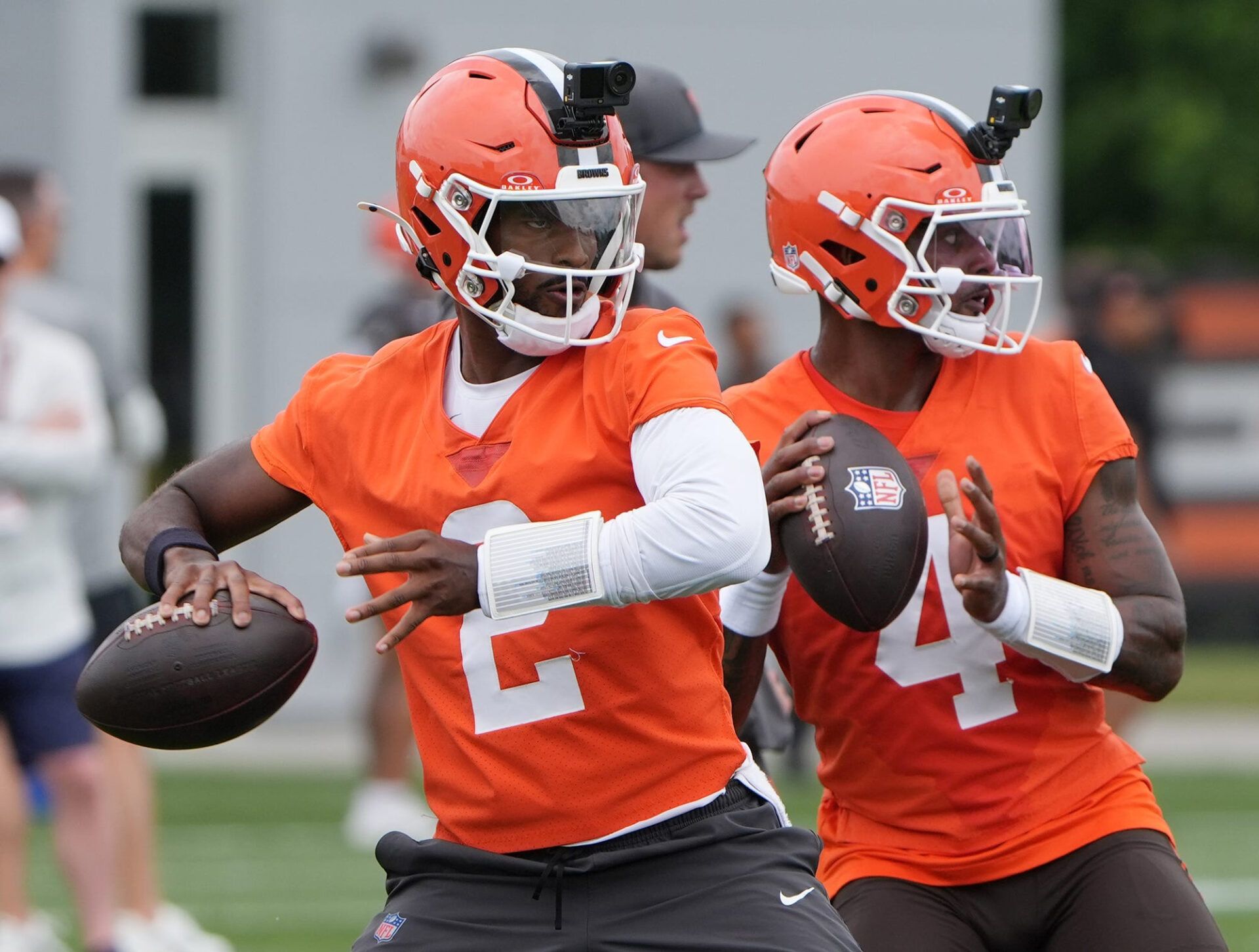 Cleveland Browns quarterbacks Shedeur Sanders and Deshaun Watson take part in a drill on the first day of minicamp at CrossCountry Mortgage Campus of the Cleveland Browns in Berea, Ohio on June 9, 2026.