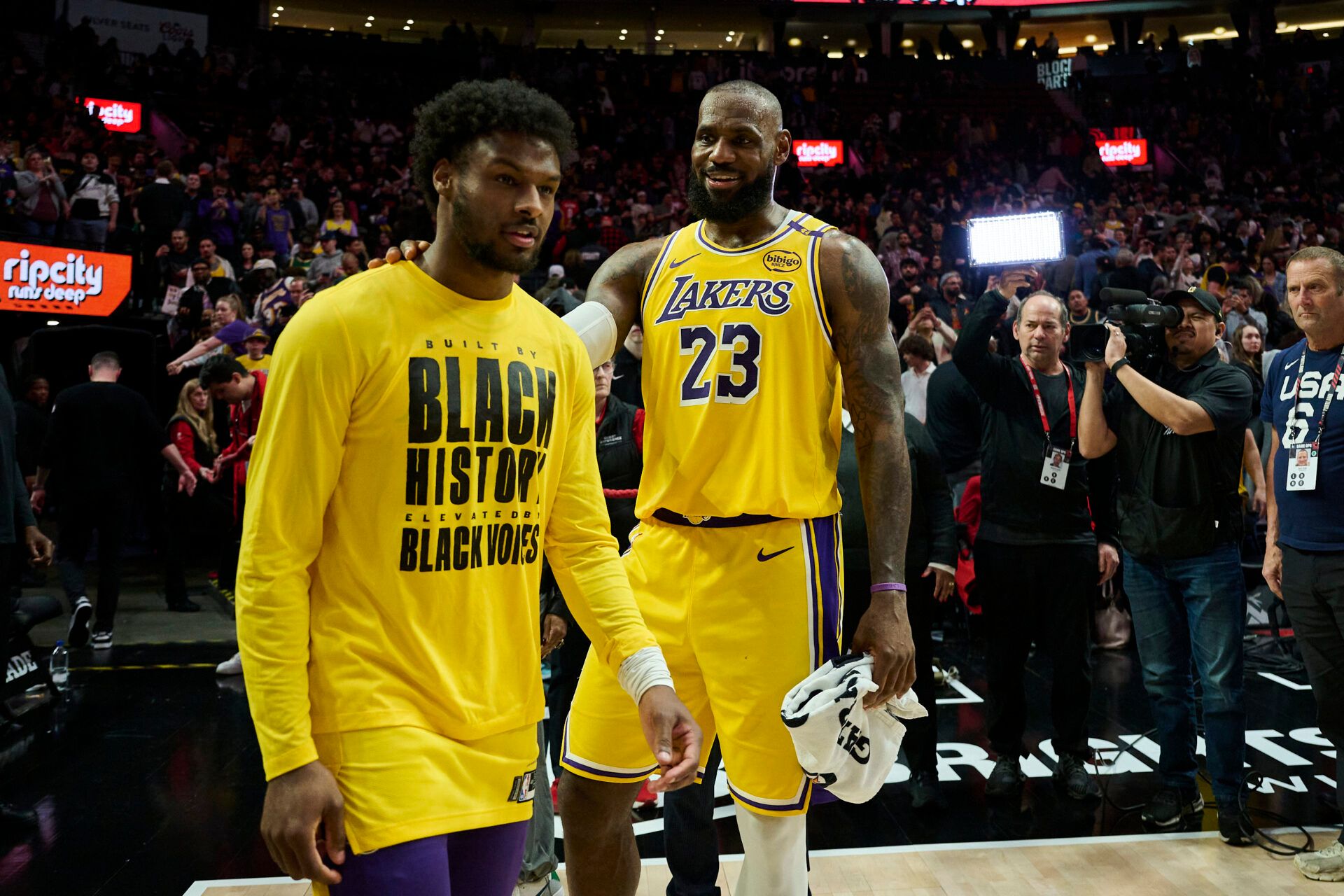 Los Angeles Lakers forward LeBron James (23) celebrates victory over the Portland Trail Blazers with his son guard Bronny James (9) at Moda Center.