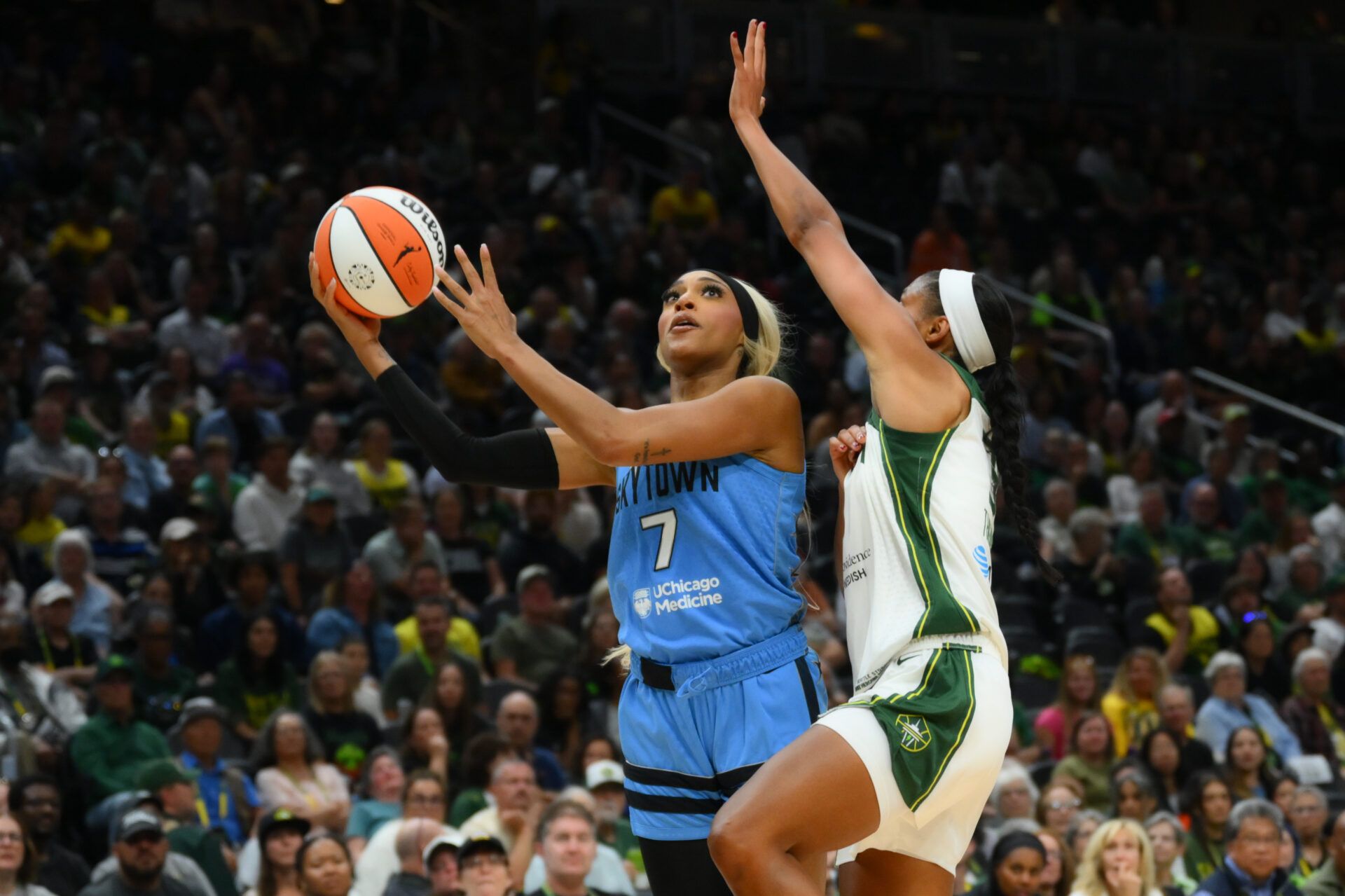 Chicago Sky guard DiJonai Carrington (7) shoots the ball while guarded by Seattle Storm forward Taylor Thierry (3) during the second half at Climate Pledge Arena.